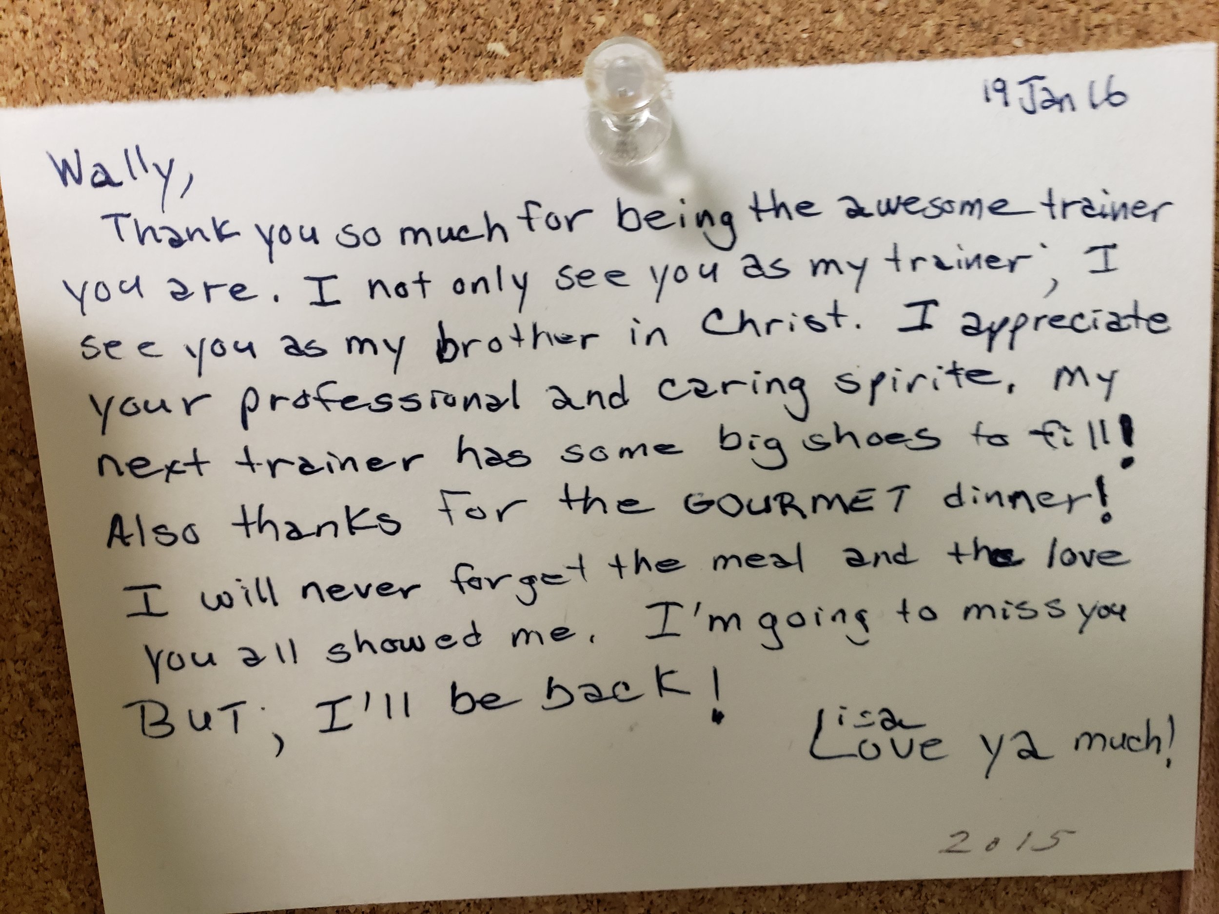 A handwritten thank you note pinned to a corkboard with a thumbtack. The note expresses gratitude to someone named Willy for being an awesome trainer, mentions appreciation for the trainer's professionalism, references a gourmet dinner, and expresses
