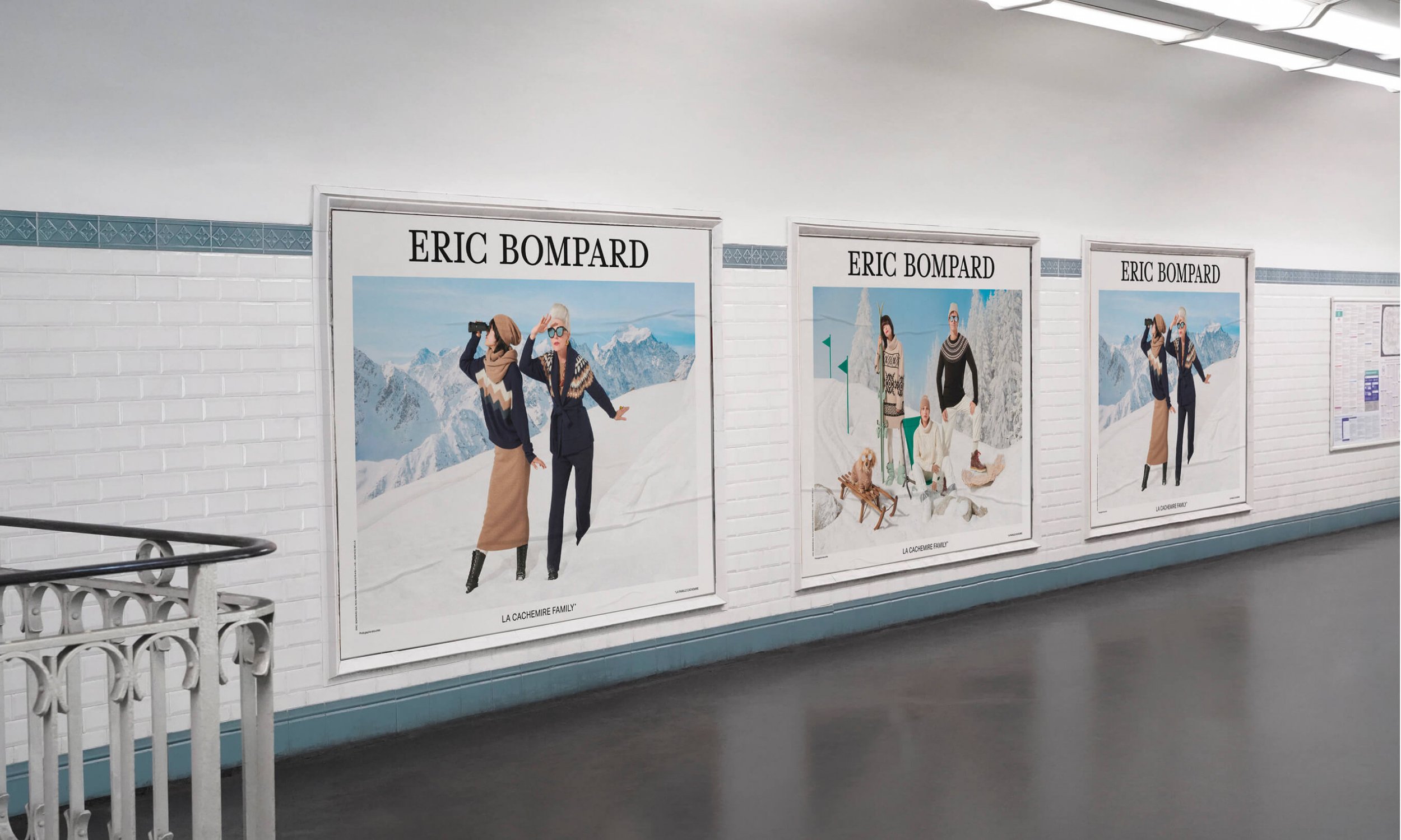 Affiches publicitaires d'Éric Bompard dans un souterrain, présentant des scènes hivernales avec des personnes en vêtements d'hiver dans un paysage neigeux.