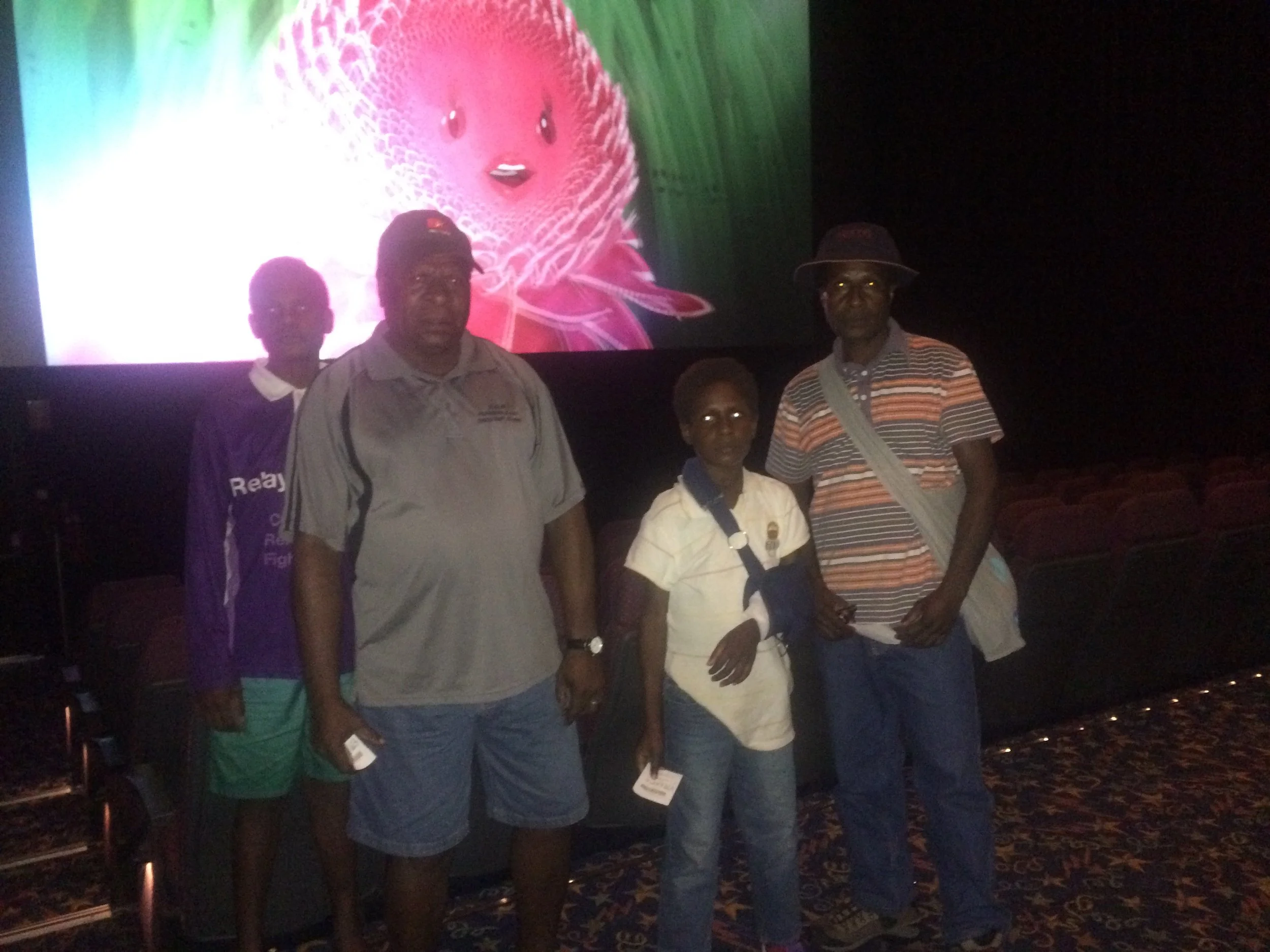 An afternoon at the movies for these two boys and their fathers. 