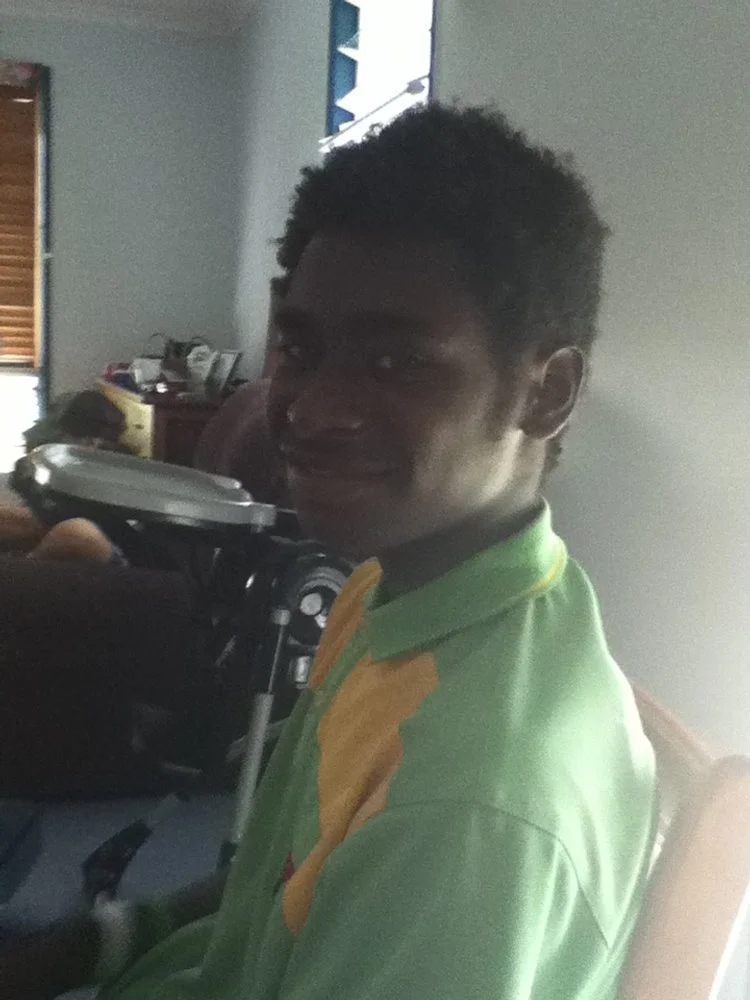 This teenager had broken his arm in two places while hunting. He hiked many kilometers to arrive in one of the coastal villages to access help and a transfer to Queensland. Here he is spending a day out of the hospital with Shelly and her family. 