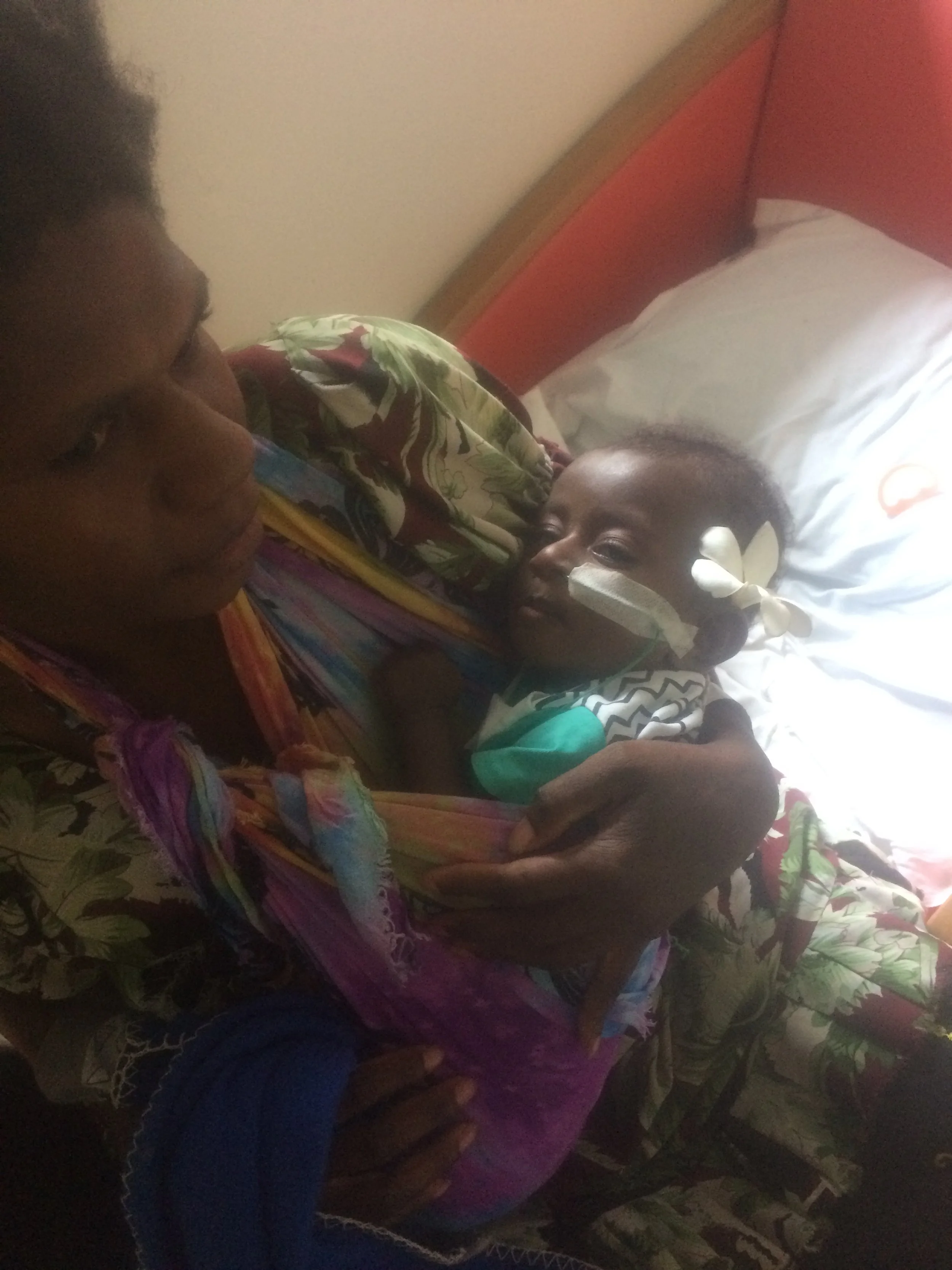 Helping a mother secure an interpreter and discussing some tests that were recommended for her baby. 