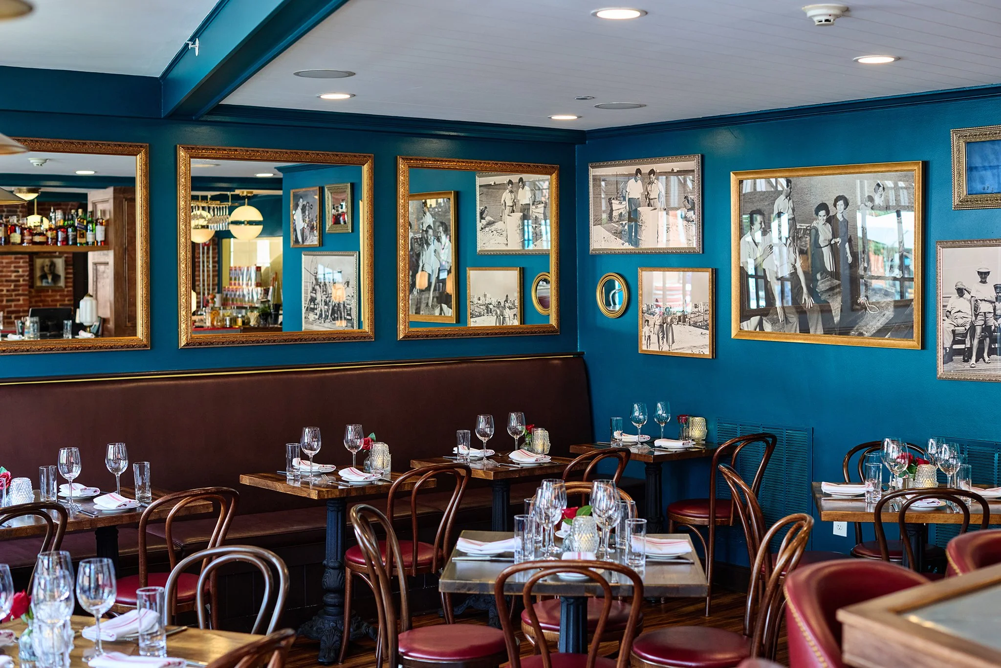 Cozy Italian restaurant interior with family photos, low seating, and warm ambient lighting at LaRosa's Italian Newburyport