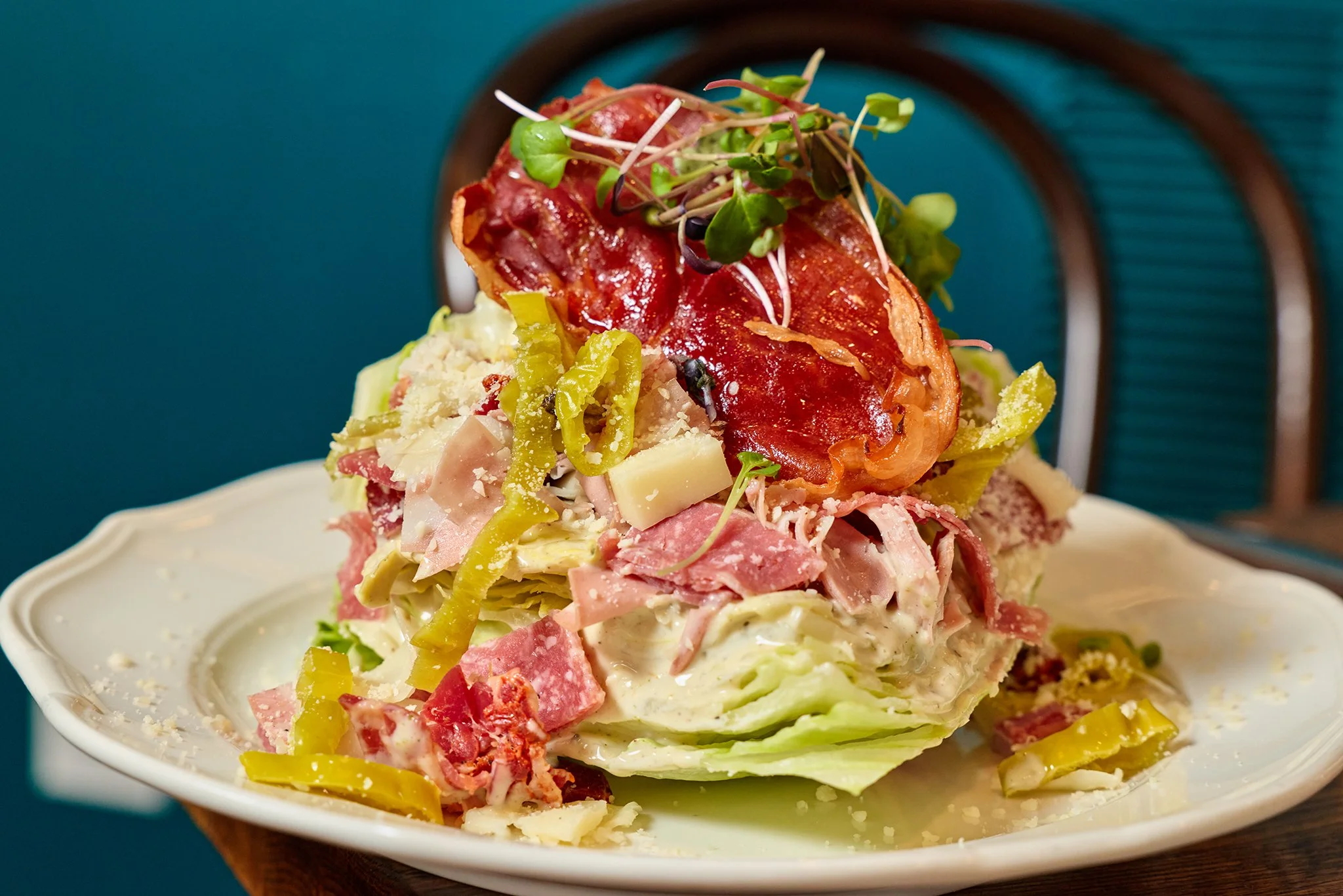 Italian wedge salad with crisp lettuce, tomatoes, italian cold cuts, and house dressing at LaRosa's Italian Newburyport