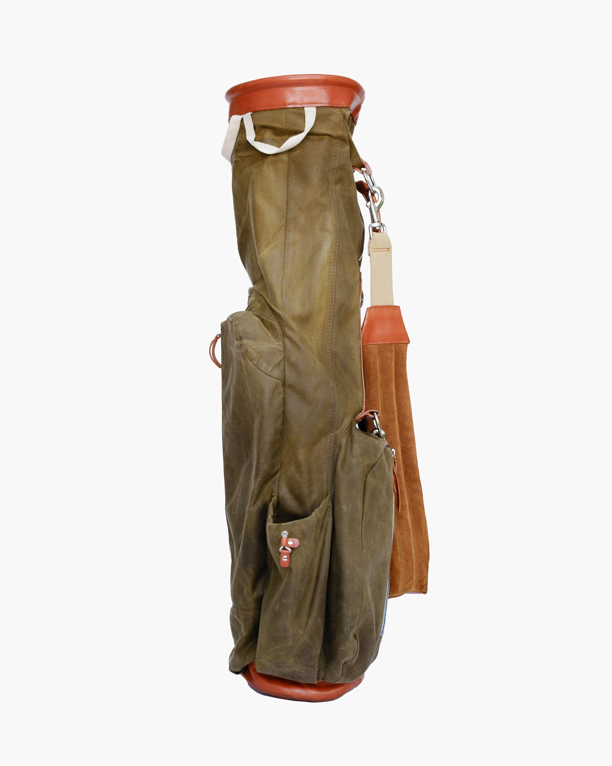 Golf bag with clubs, featuring leather and fabric materials, standing upright