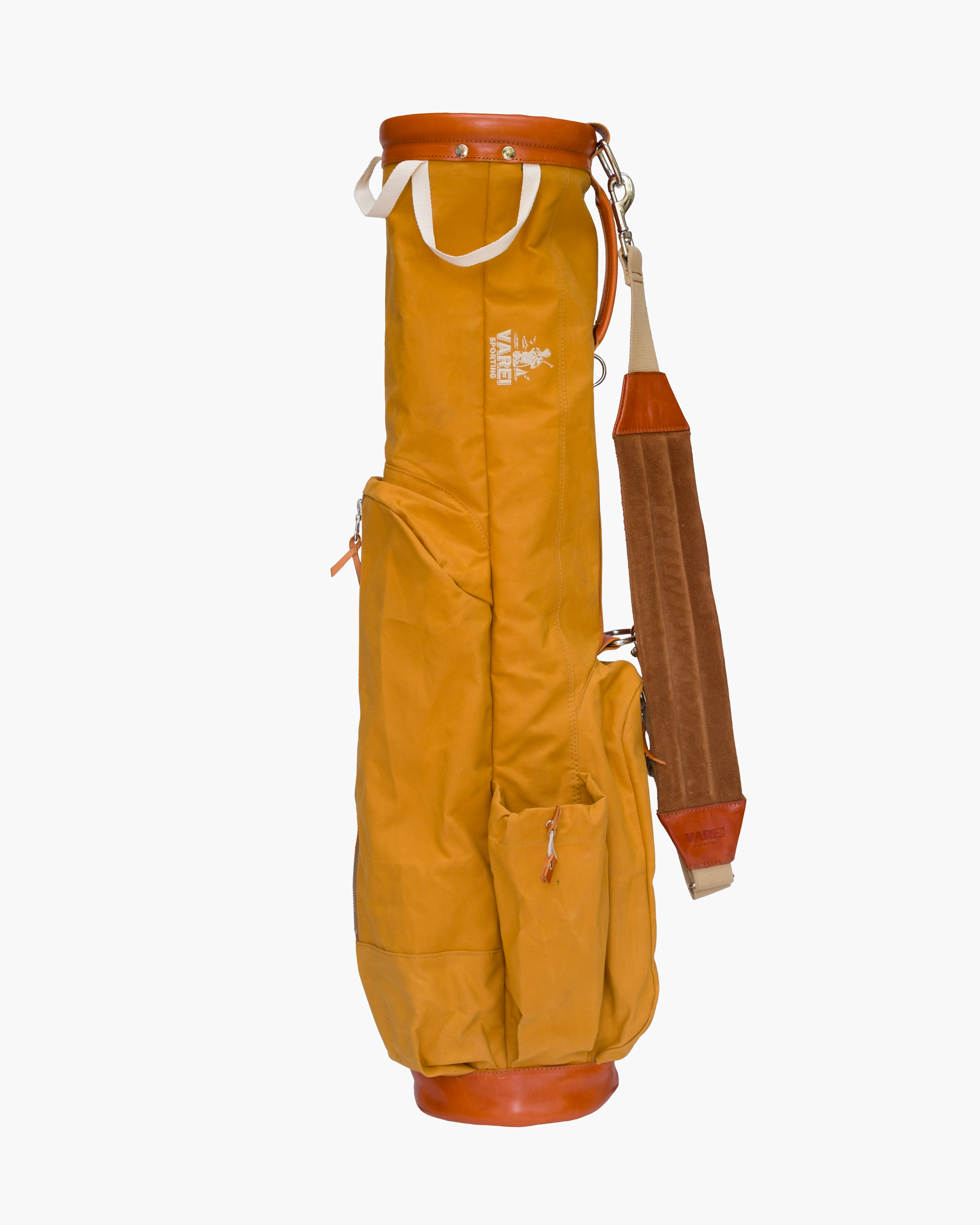 Yellow golf bag with brown leather accents and a brown padded shoulder strap, standing upright on a white background.