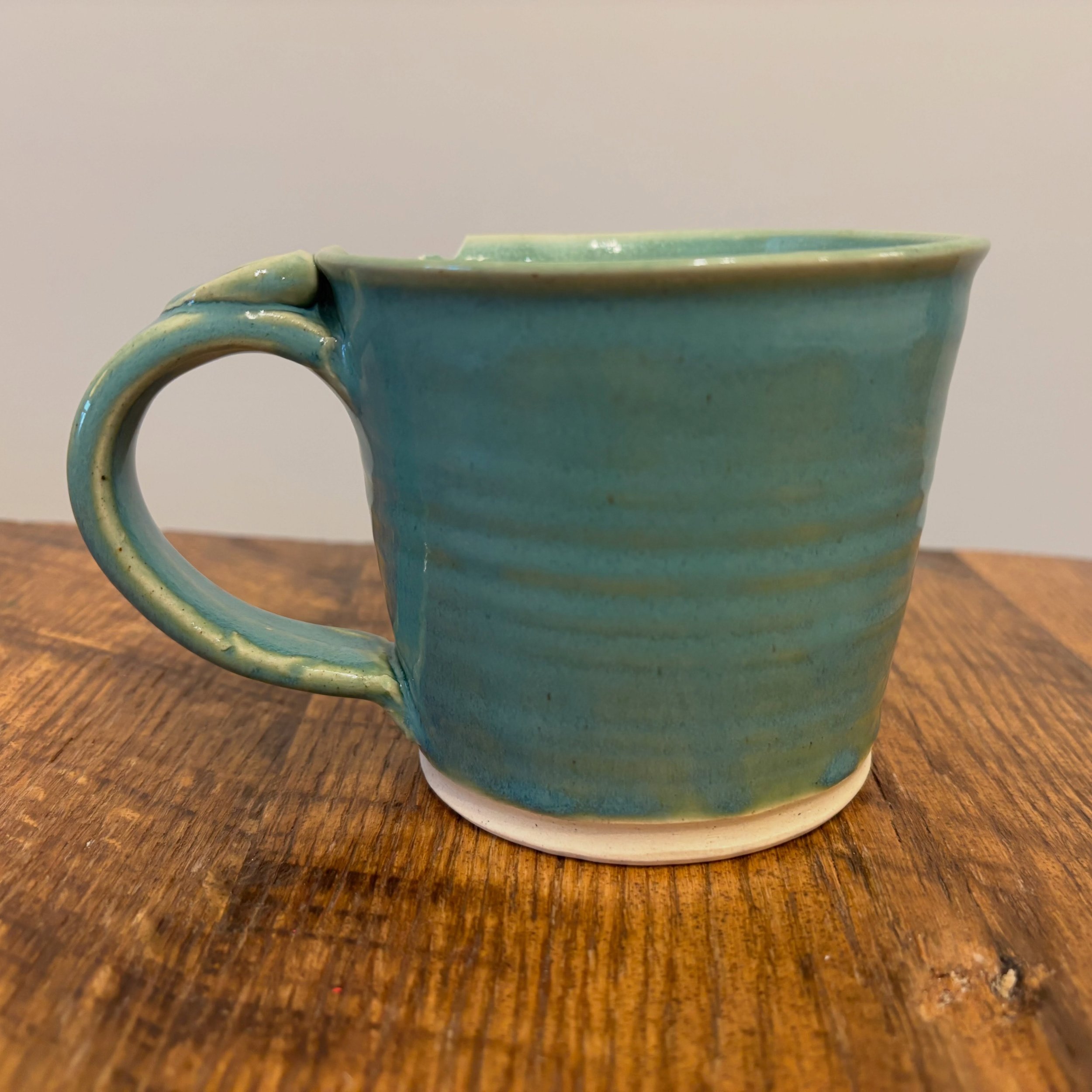 This is where it all started.

This is the very first mug I ever made. And apparently, even from the beginning, I thought mugs needed little friends waiting inside. 

I remember feeling so proud of this piece. It wasn&rsquo;t perfect, but it felt rig