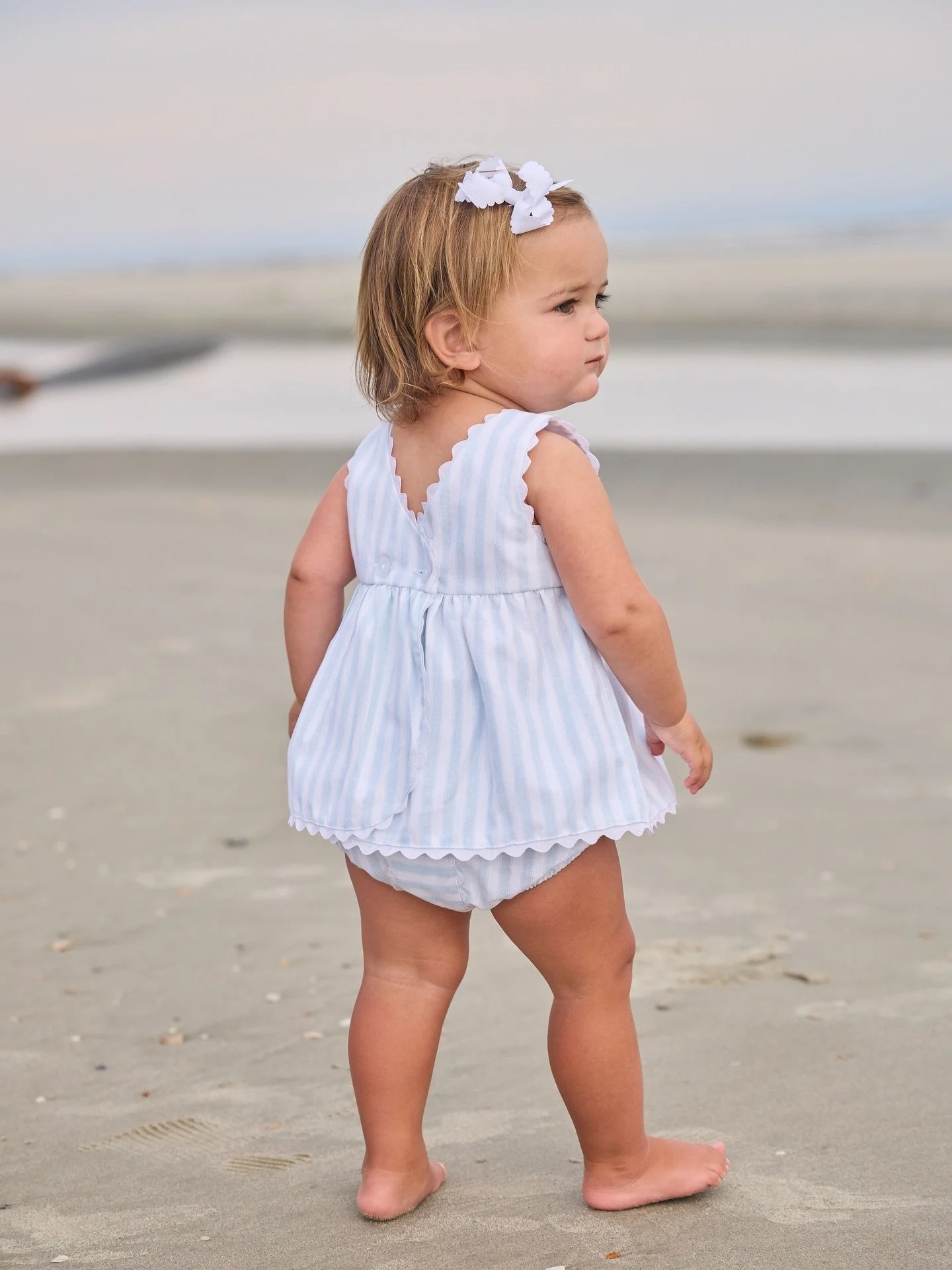 The sweetest Savannah Stripe from @littleenglishclothing is perfect for any occasion🤍🩵 
Available in store &amp; online!

 #shopoverthemoonchildren #taptoshop #weship #childrensboutique