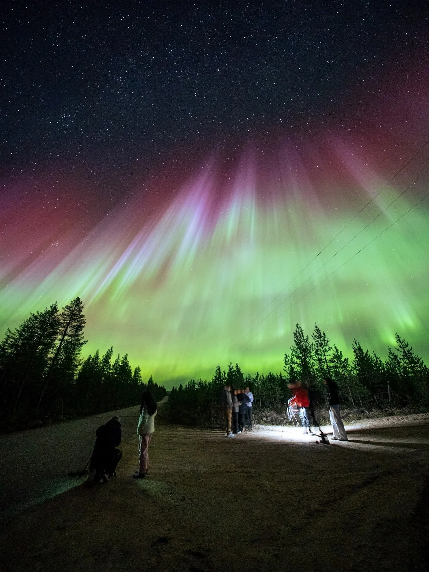 Red auroras happen about 200km-250km above earth but even up to 1000km during big events.

October 10th indeed was a big event, and there&rsquo;s no words to describe what it feels like to stand right under this mammoth wall of light far up north her