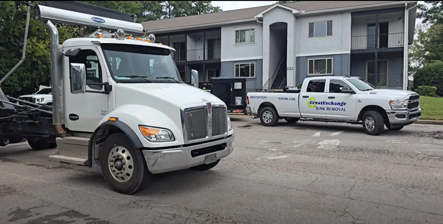 Great Exchange Junk Removal truck and Carolina Canz dumpster truck staged for bulk apartment cleanout in Columbia SC