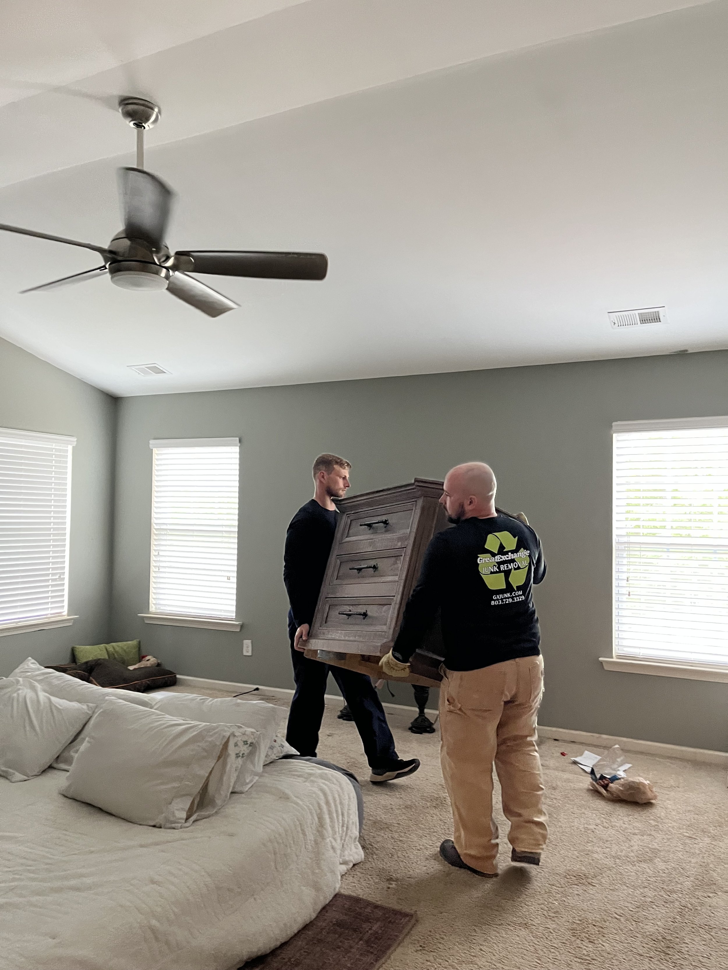Great Exchange Junk Removal Team moving furniture