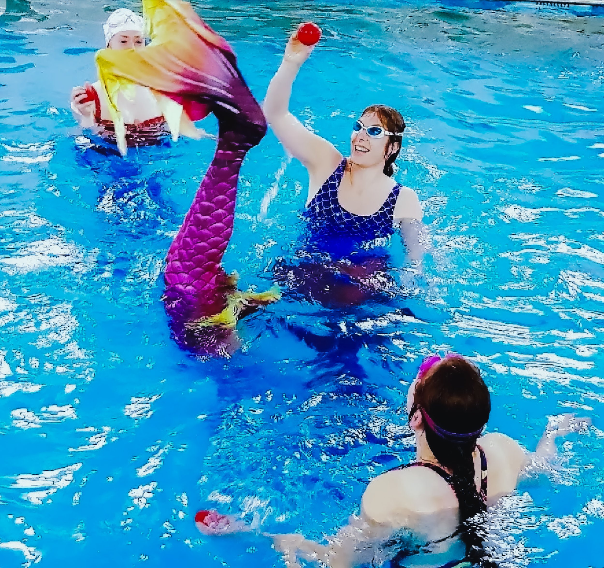 Certified mermaid swimming instructor leading a fun party session in Dorset pool