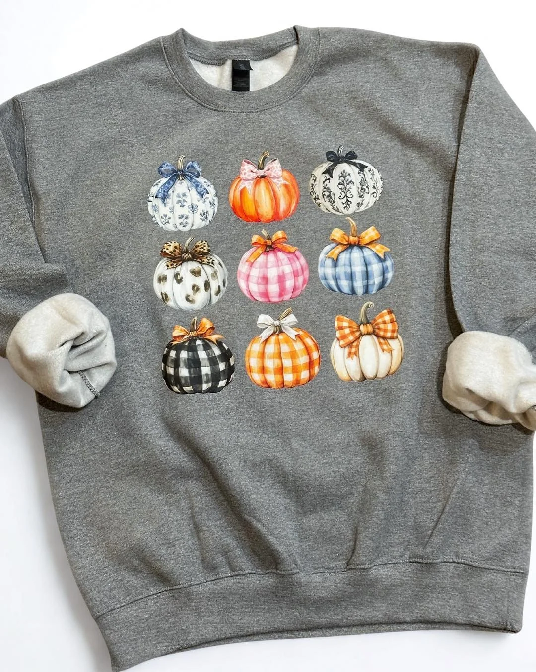 🎃🍂 FALL FAVORITE ALERT! 🍁✨

How cute are these patterned pumpkins?! From gingham to leopard to toile &mdash; this cozy gray sweatshirt is giving all the fall vibes in the most stylish way. Perfect for pumpkin patch days, fall festivals, or cozy ni
