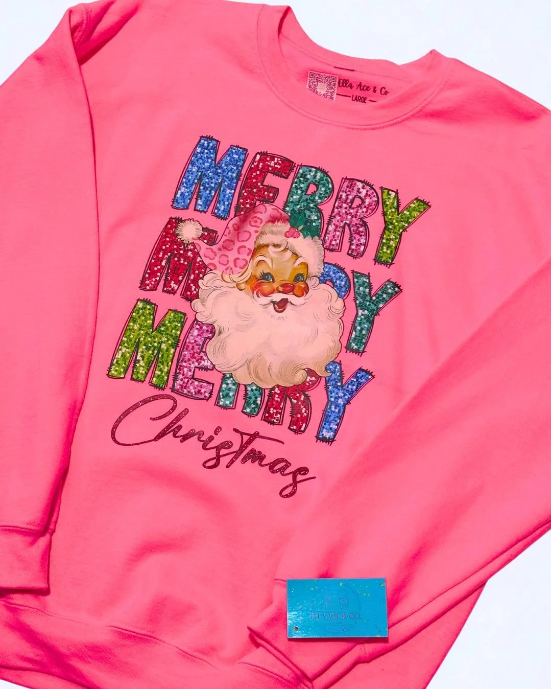 🎅✨ MERRY MERRY MERRY Christmas! ✨🎅

This hot pink sweatshirt is giving all the festive vibes! 💖
Featuring the cutest retro Santa and glittery letters that sparkle brighter than your Christmas lights &mdash; it&rsquo;s the perfect mix of cozy + che