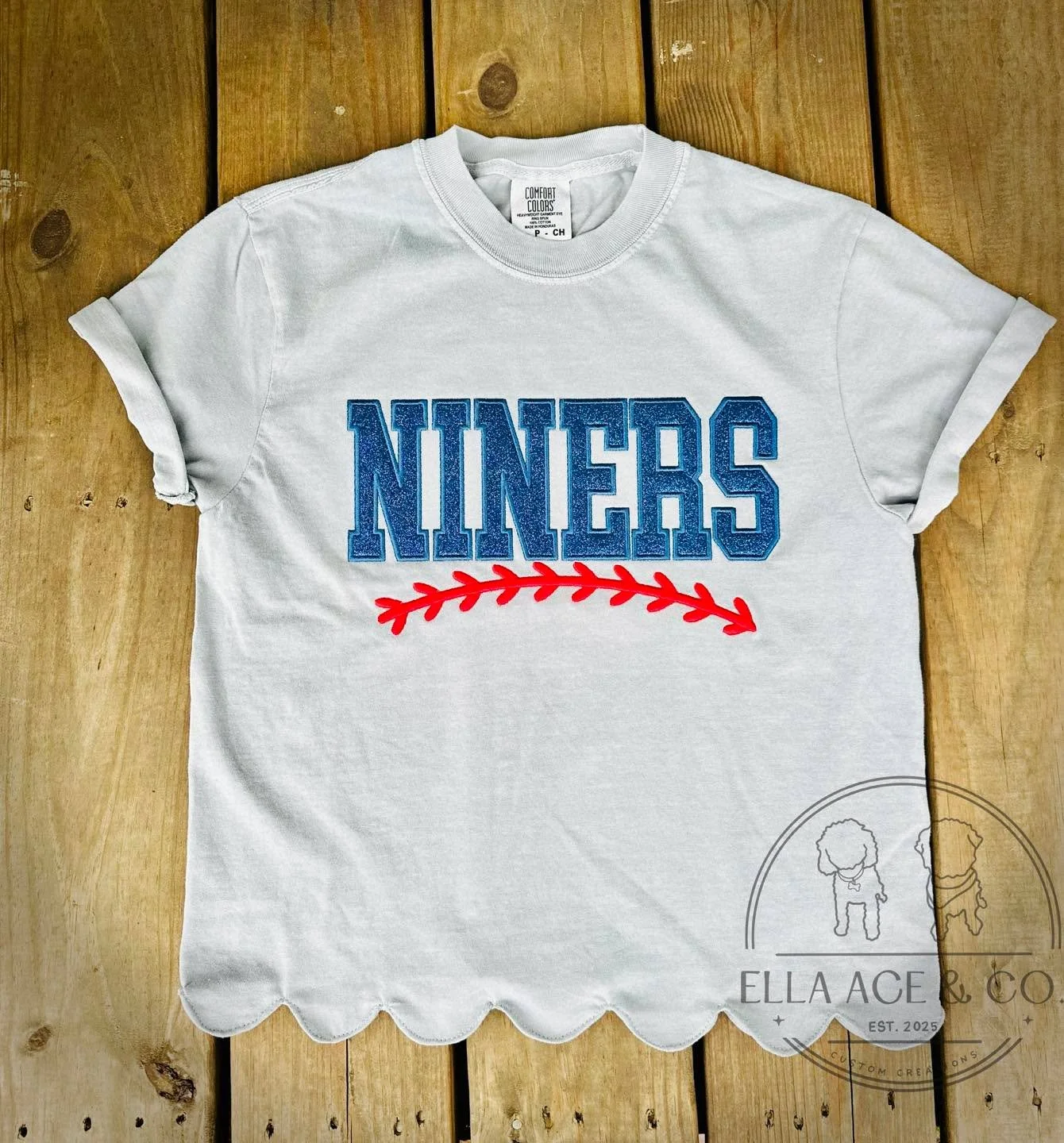 ⚾️✨ Custom Team Embroidery Just Got Even Cuter! ✨⚾️

Show off your team spirit in style with our Scallop Hem Embroidered Tees! The feminine scalloped hem adds the perfect touch while custom embroidery makes each shirt uniquely yours.

💙 Customize wi