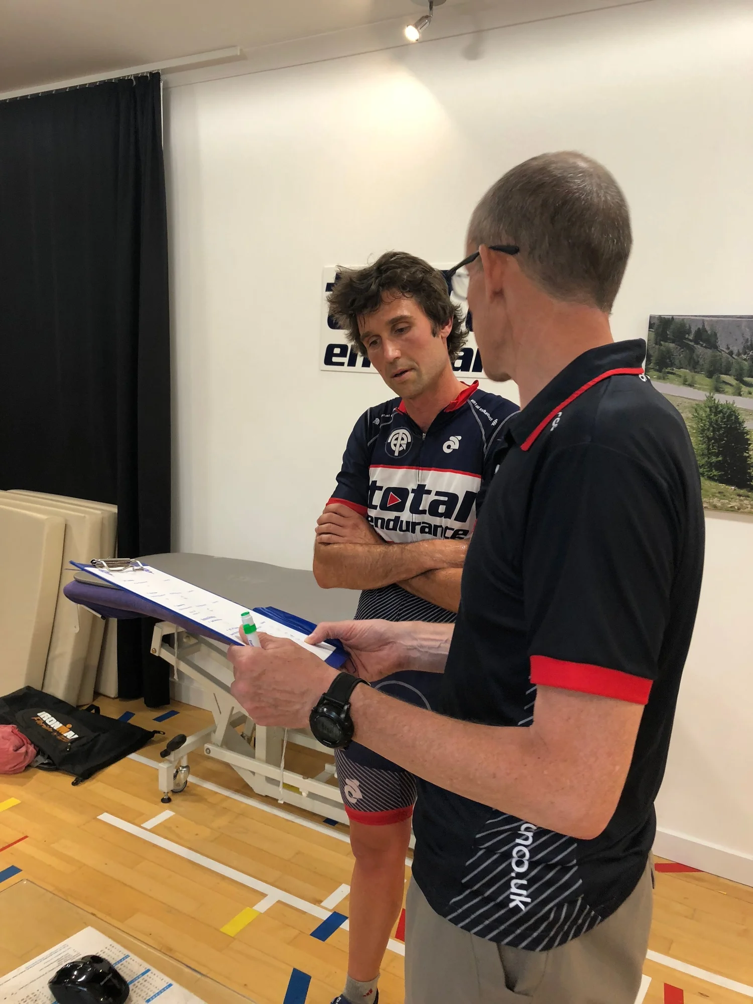 Coach talking an athlete through their test results