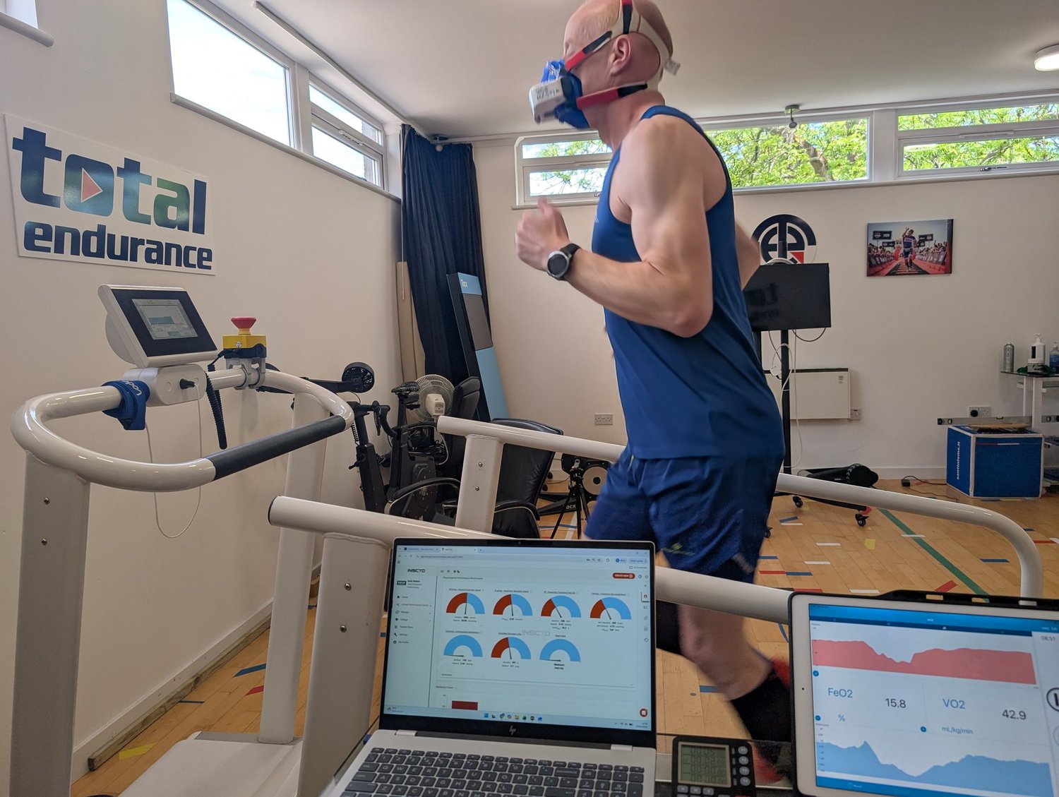 Athlete mid-test on the treadmill in the Total Endurance lab in Aberdeen, wearing a gas analysis mask