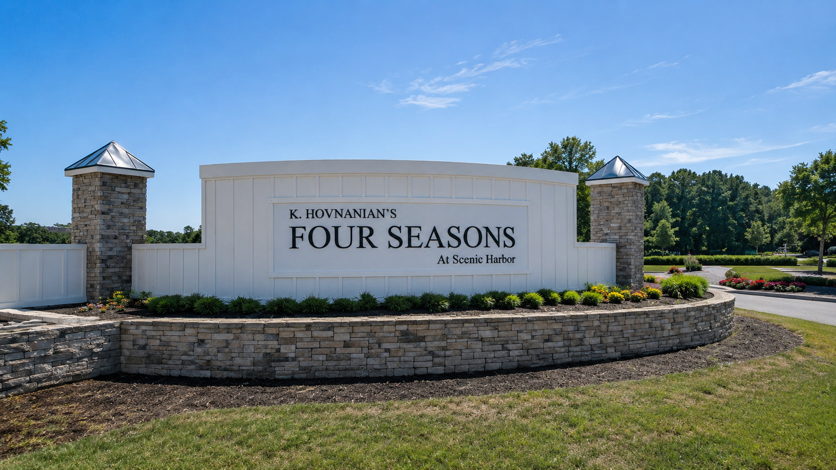 Custom monument entrance sign for K. Hovnanian’s Four Seasons at Scenic Harbor with dimensional lettering and stone columns