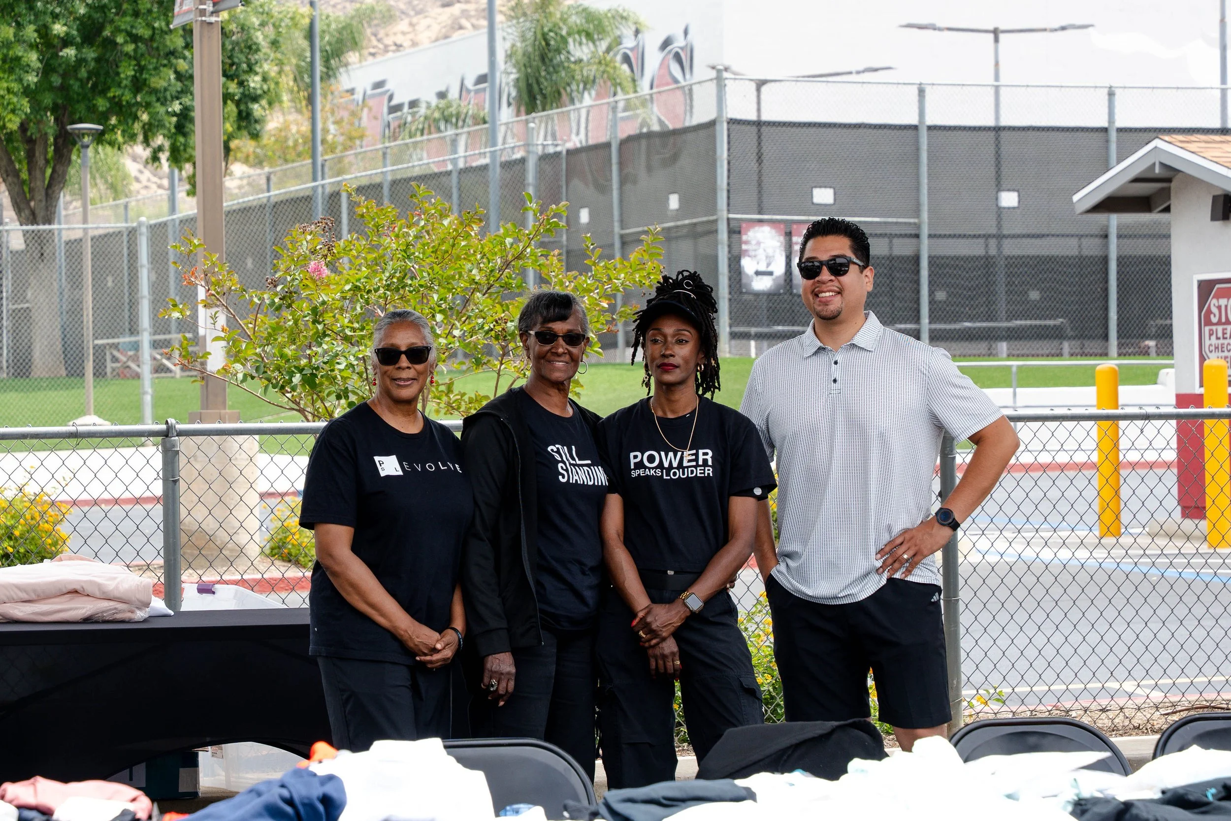 Moreno Valley Mayor, Ulises Cabrera, standing with organizers at Camp