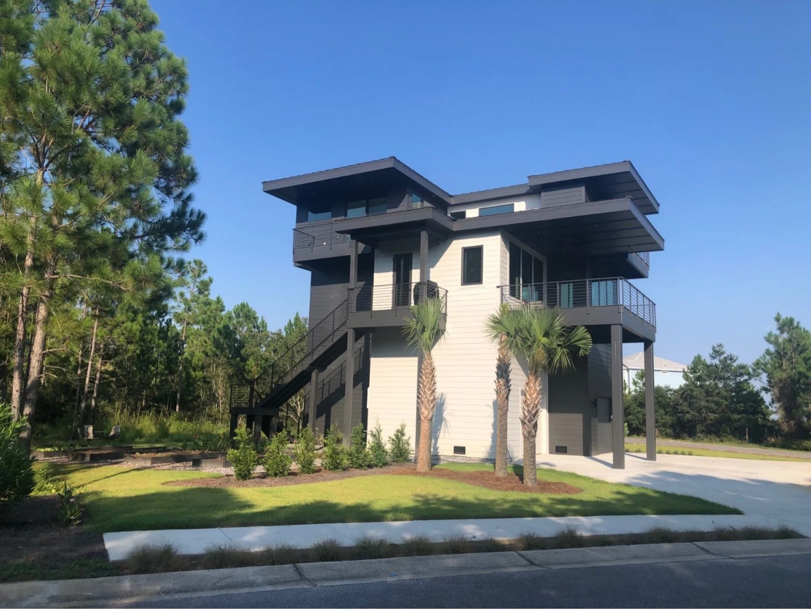 Modern beach or vacation house construction including interior design located in Gulf Breeze, Florida designed by the architecture firm Born Architects, which serves the northwestern Florida area including Port St. Joe, Gulf Breeze, St. George Island