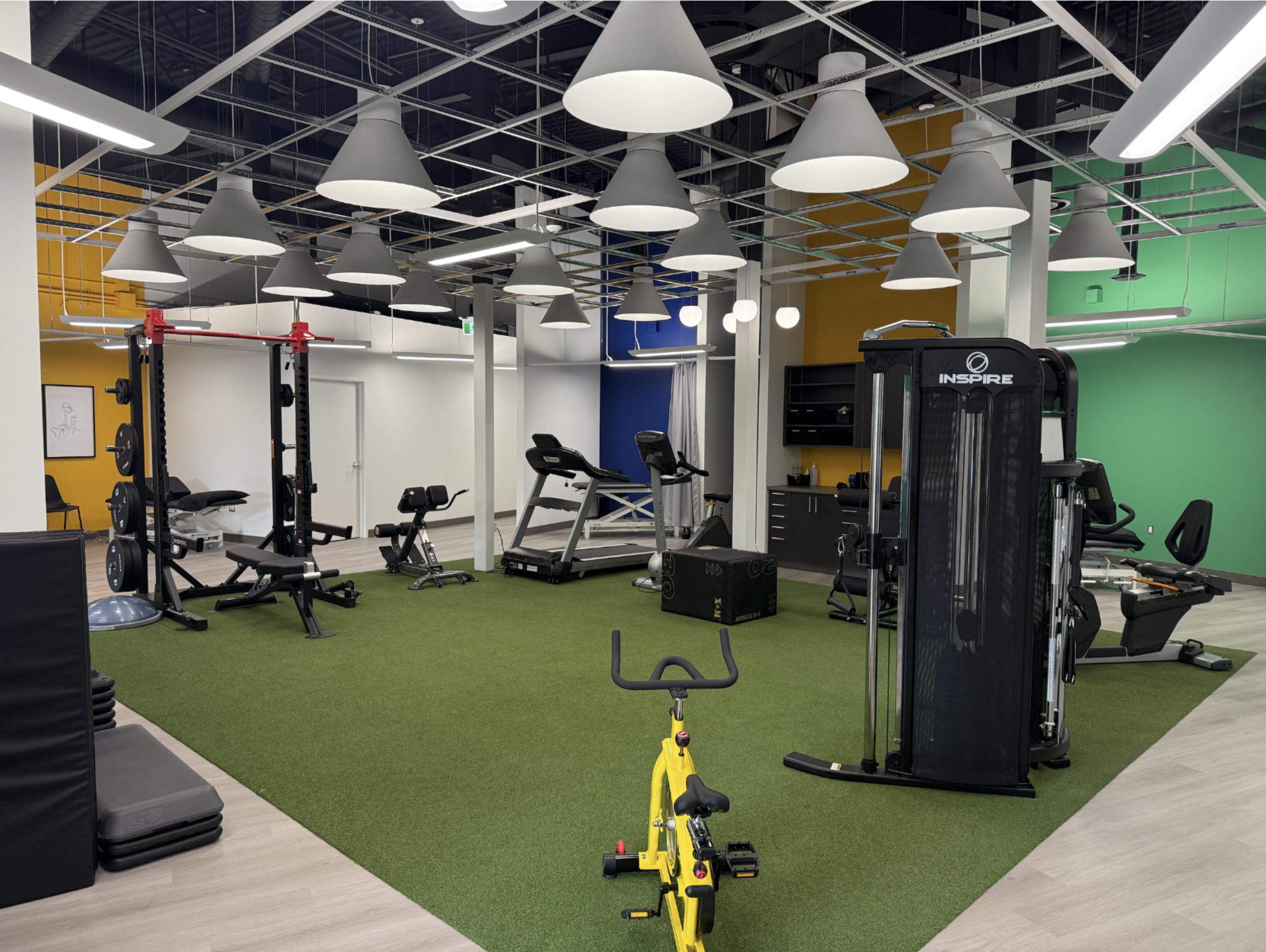 Turf training area with treadmill, bike and weight station
