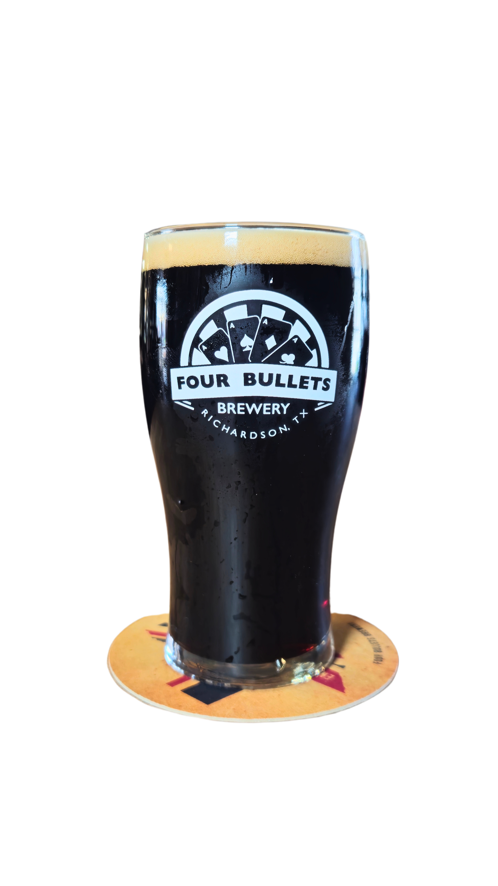 A pint of dark beer in a glass with a logo for Four Bullets Brewery, sitting on a branded coaster.