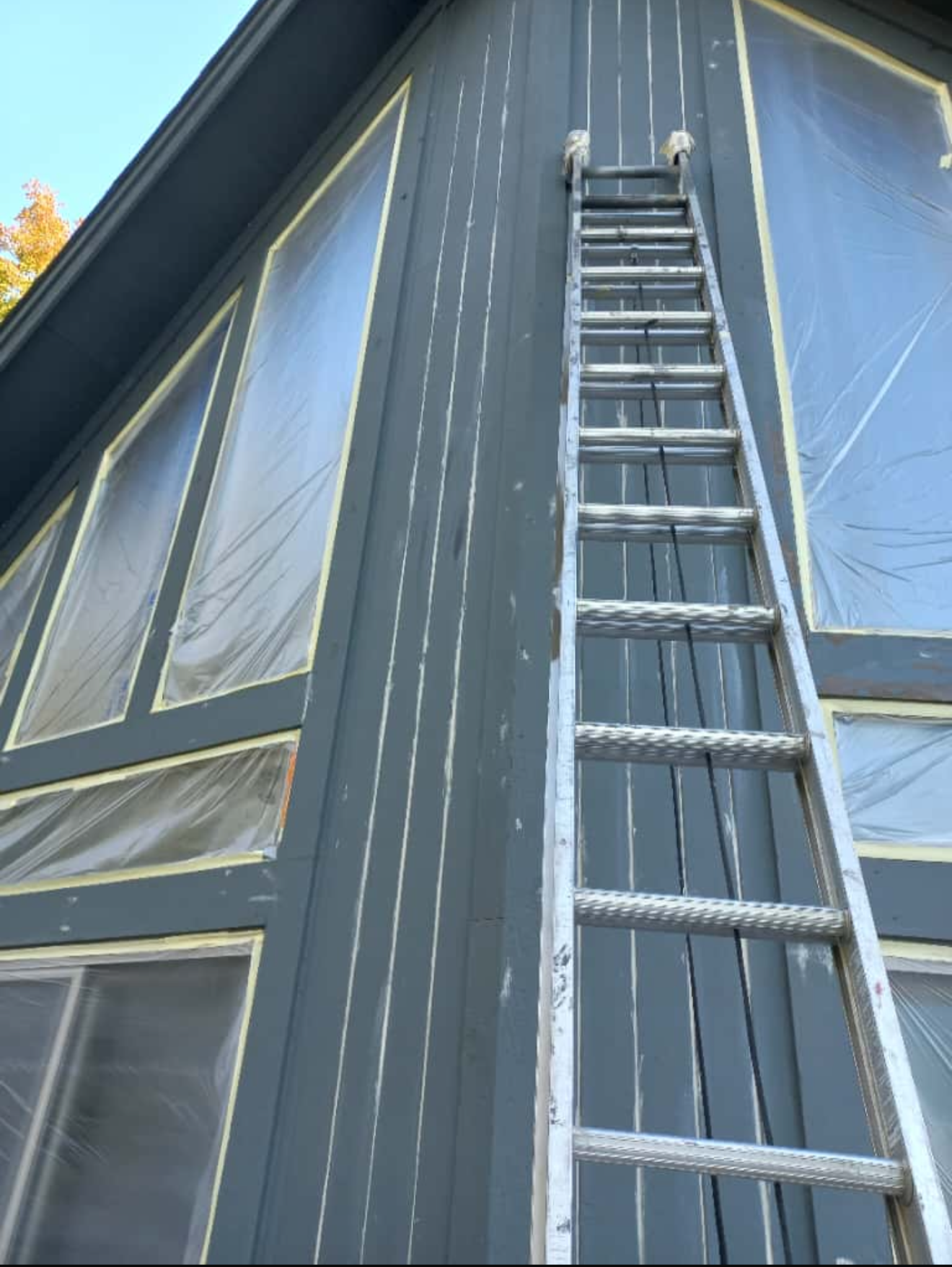 Extensive caulking and sealing at the peak of this Lake Minnetonka home to prevent future moisture intrusion.