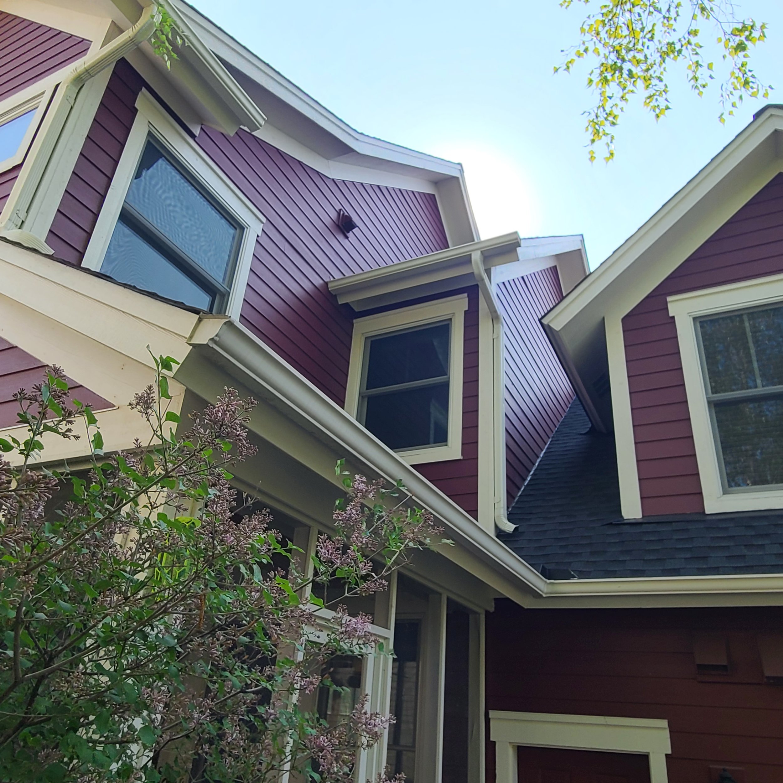 Exterior repaint in Edina’s Countryside neighborhood featuring classic red siding and crisp cream trim