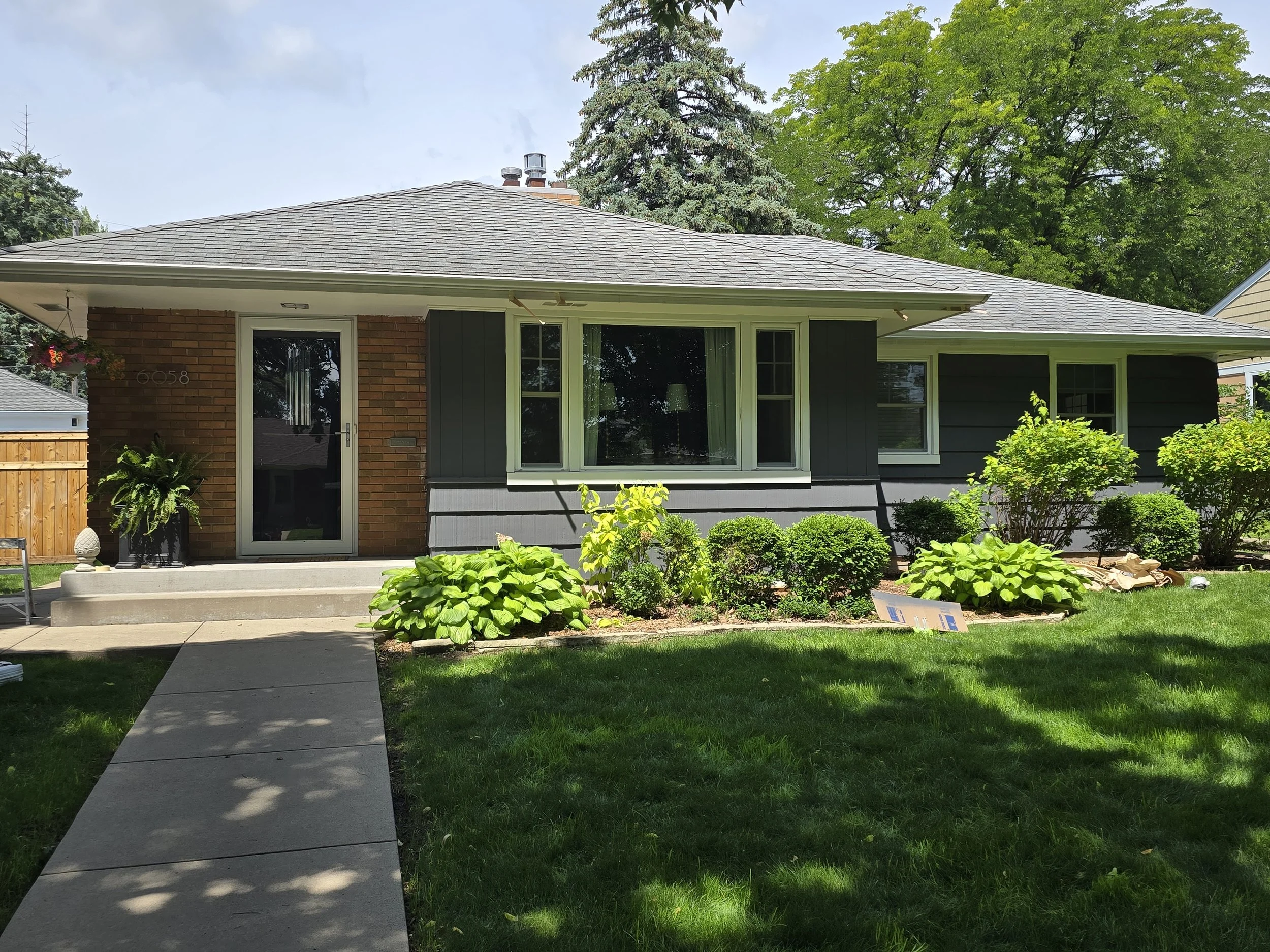 Mid-century rambler repaint in the Armatage neighborhood, finished in Sherwin-Williams Peppercorn for a bold, timeless look