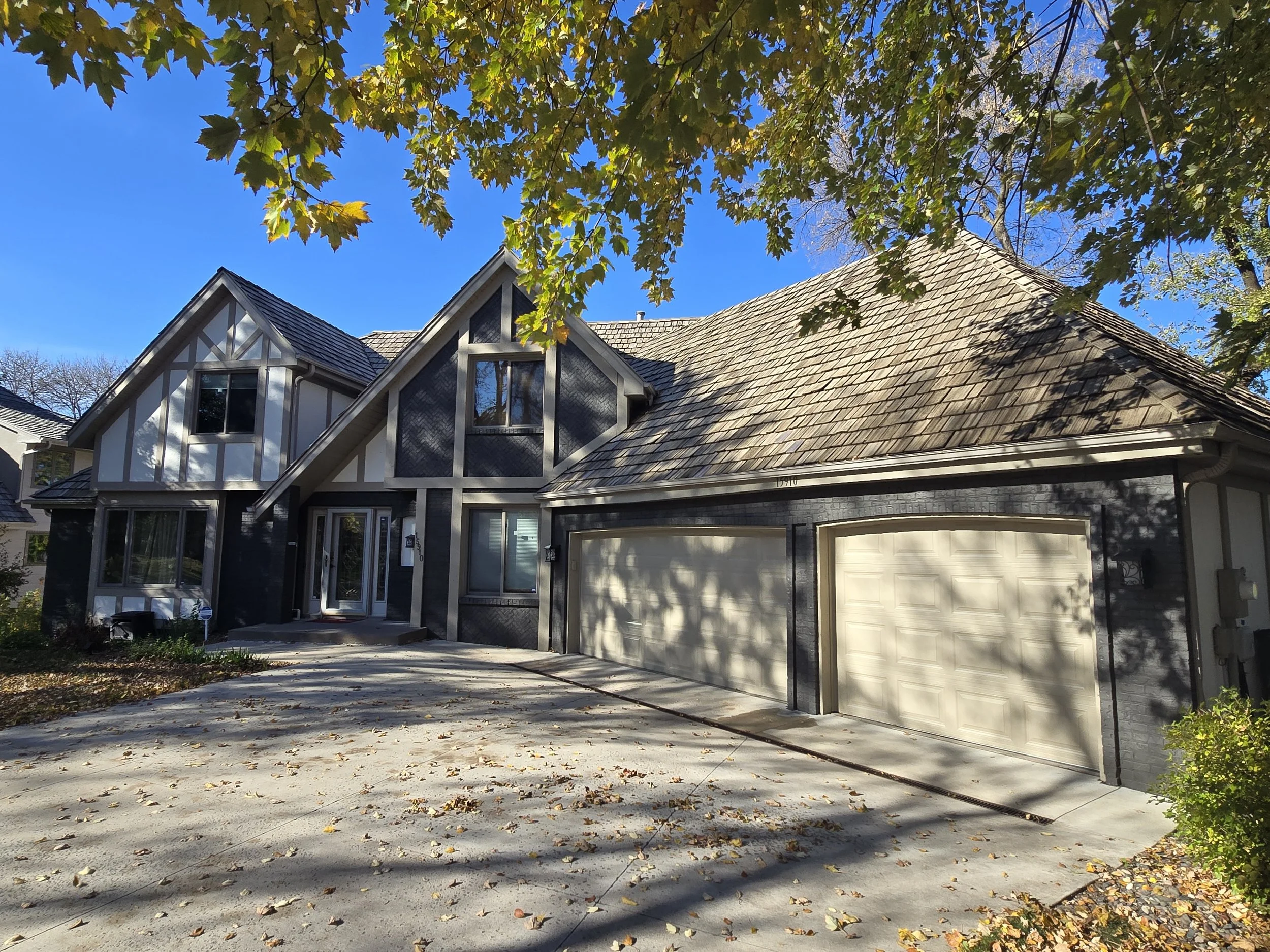 Modern dark Tudor-style home after exterior painting in Eagan MN by Best House Painters