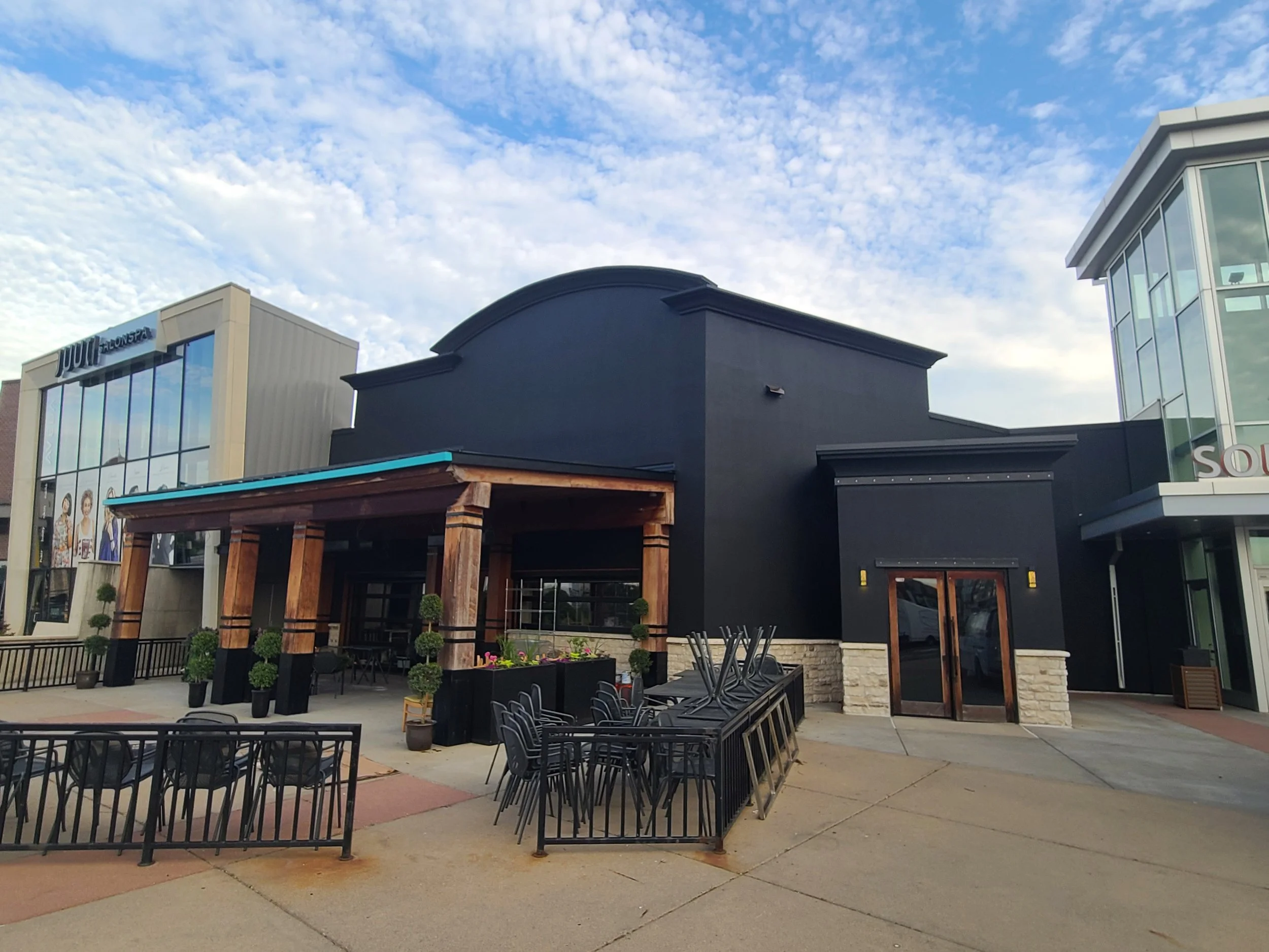 Bold dark exterior transformation for a Peoples Organic location in Southdale Mall, delivering a modern, high-contrast finish built for durability and visibility.