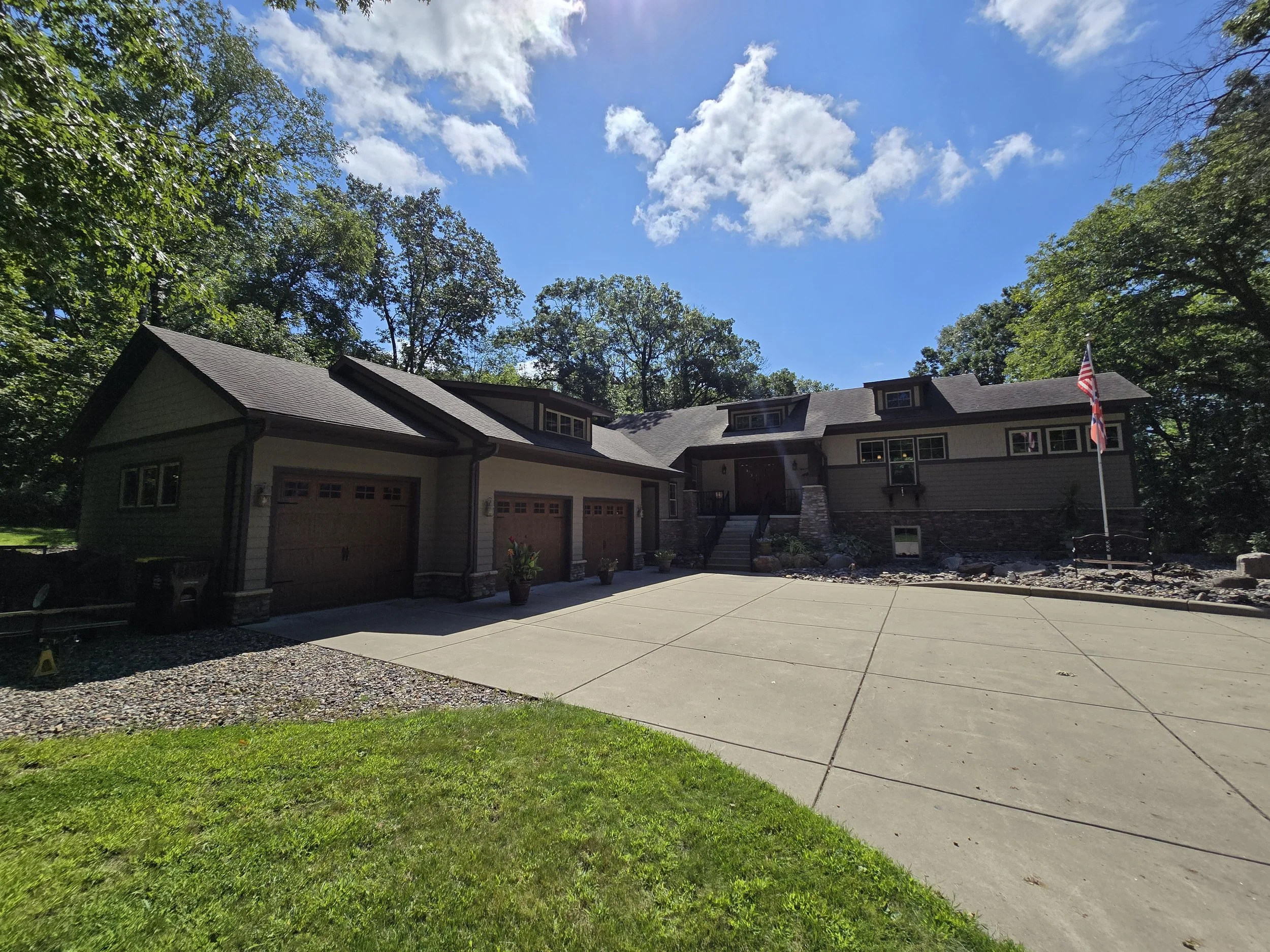 Luxury exterior repaint on a custom craftsman home near White Bear Lake