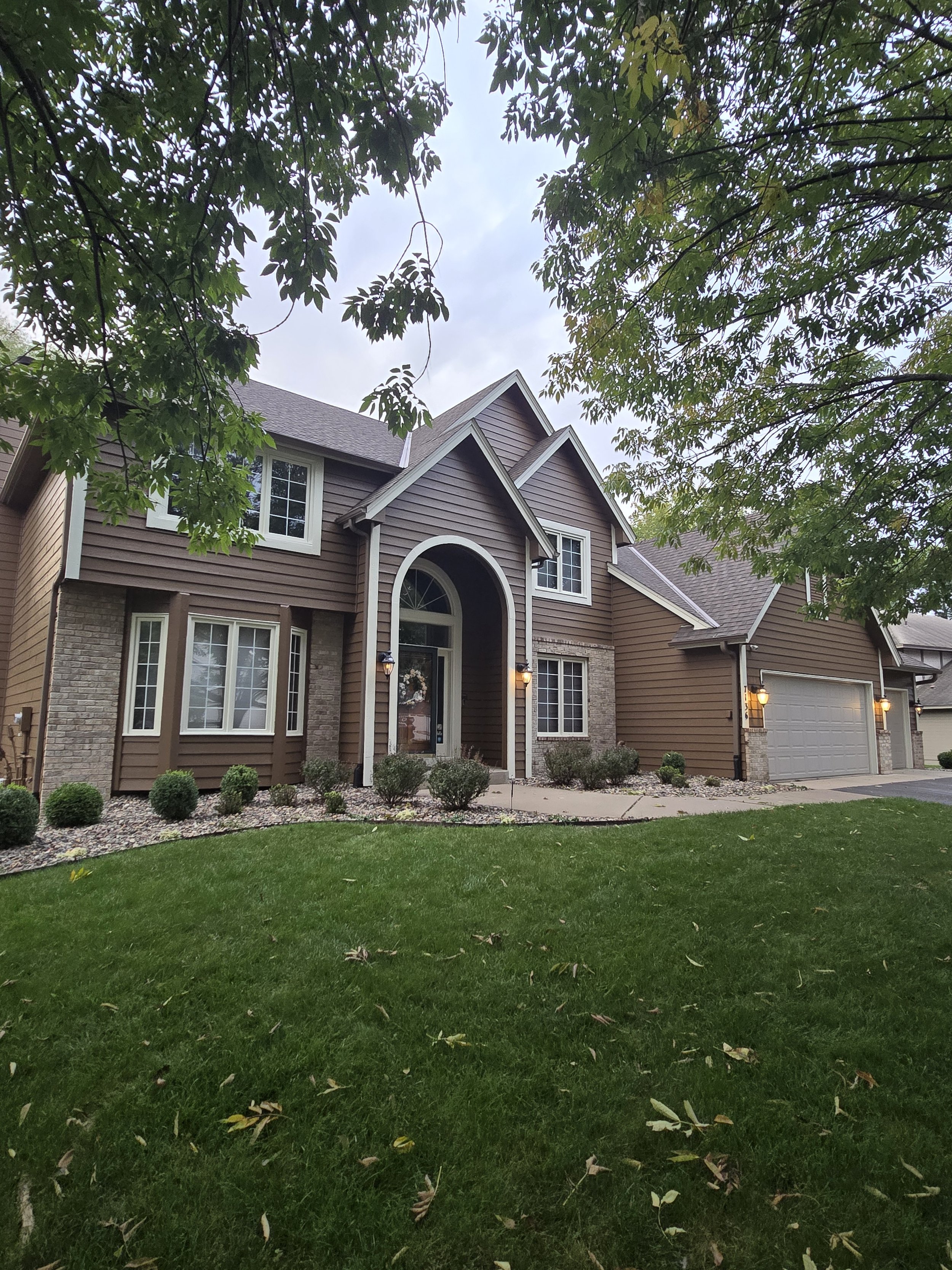 eagan-exterior-house-painting-brown-arched-entry.jpg