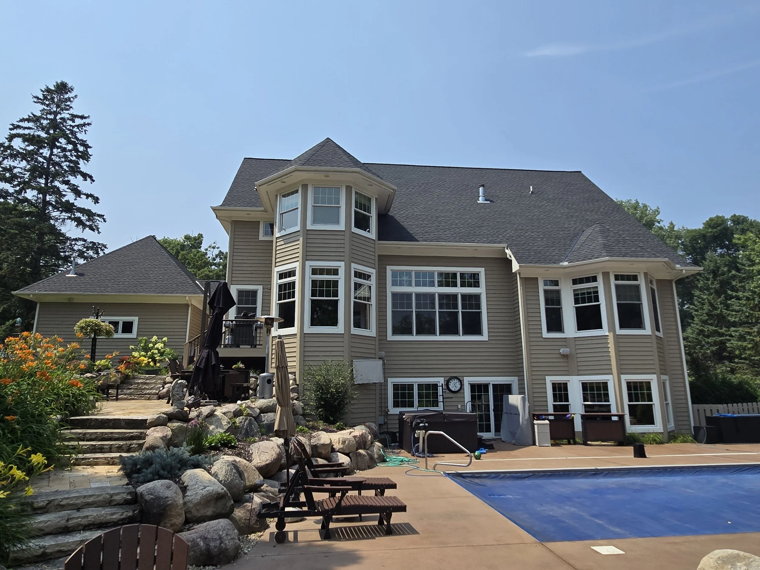 Luxury Minnetonka home with fresh exterior paint and backyard pool near Lake Minnetonka