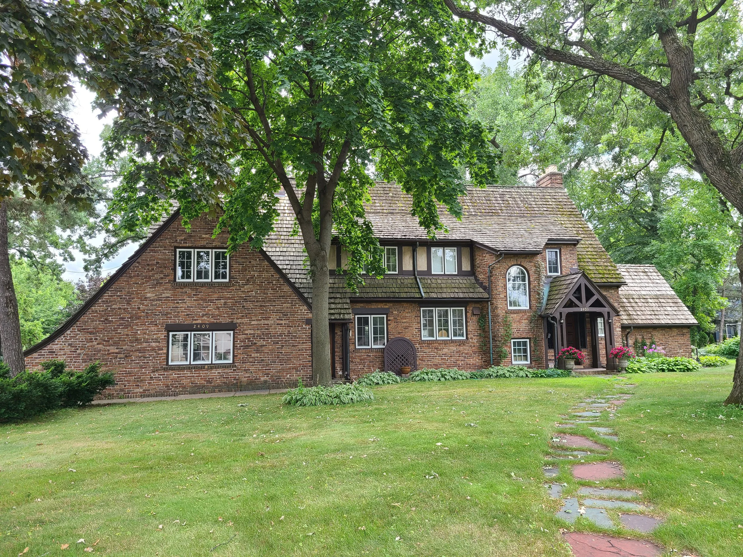 Classic Morningside Tudor refreshed with detailed trim, window, and glazing work that preserves the character while sharpening the lines