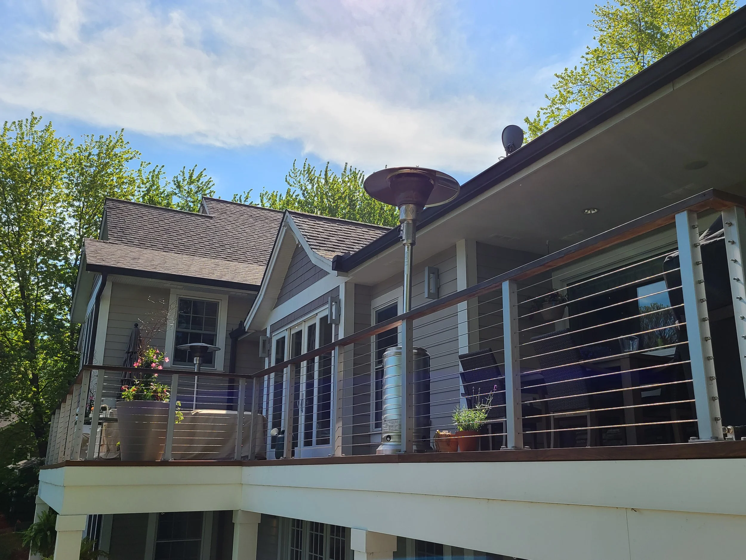 Exterior repaint on an updated Edina home with composite decking and modern trim details