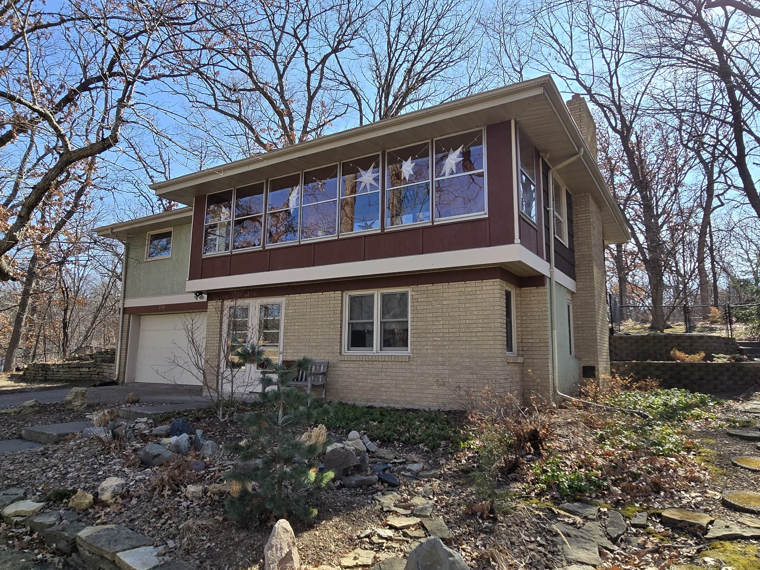 Before exterior painting of a modern Minneapolis home prior to repaint and exterior refresh.