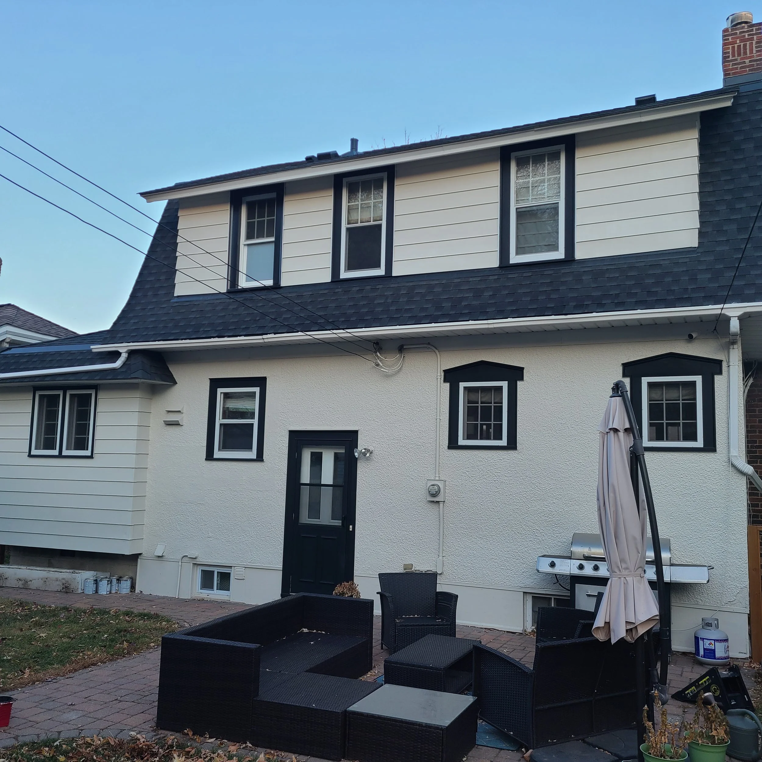 Professional exterior painting on a classic Mac-Groveland stucco home in St. Paul