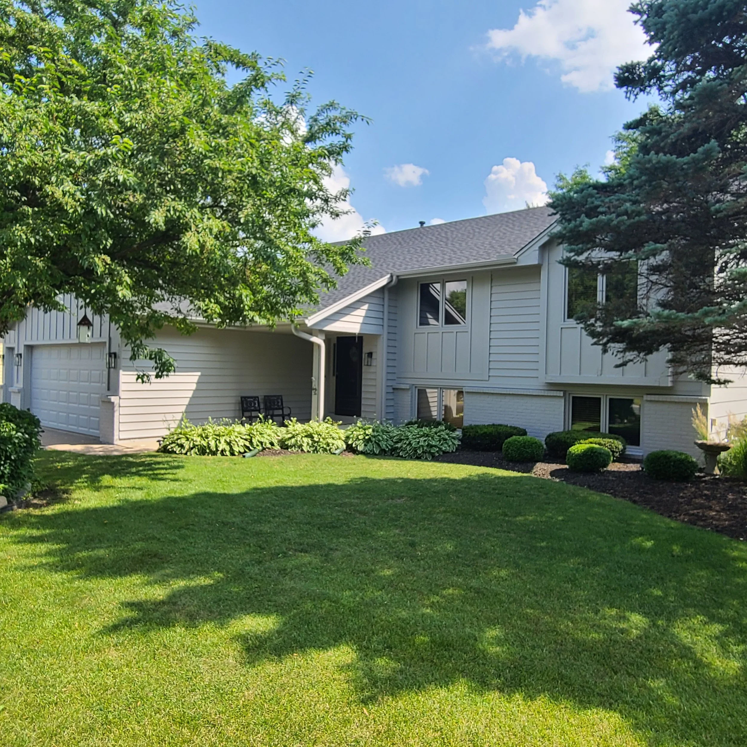 Light gray exterior repaint that brightened this Bloomington split-level and boosted curb appeal