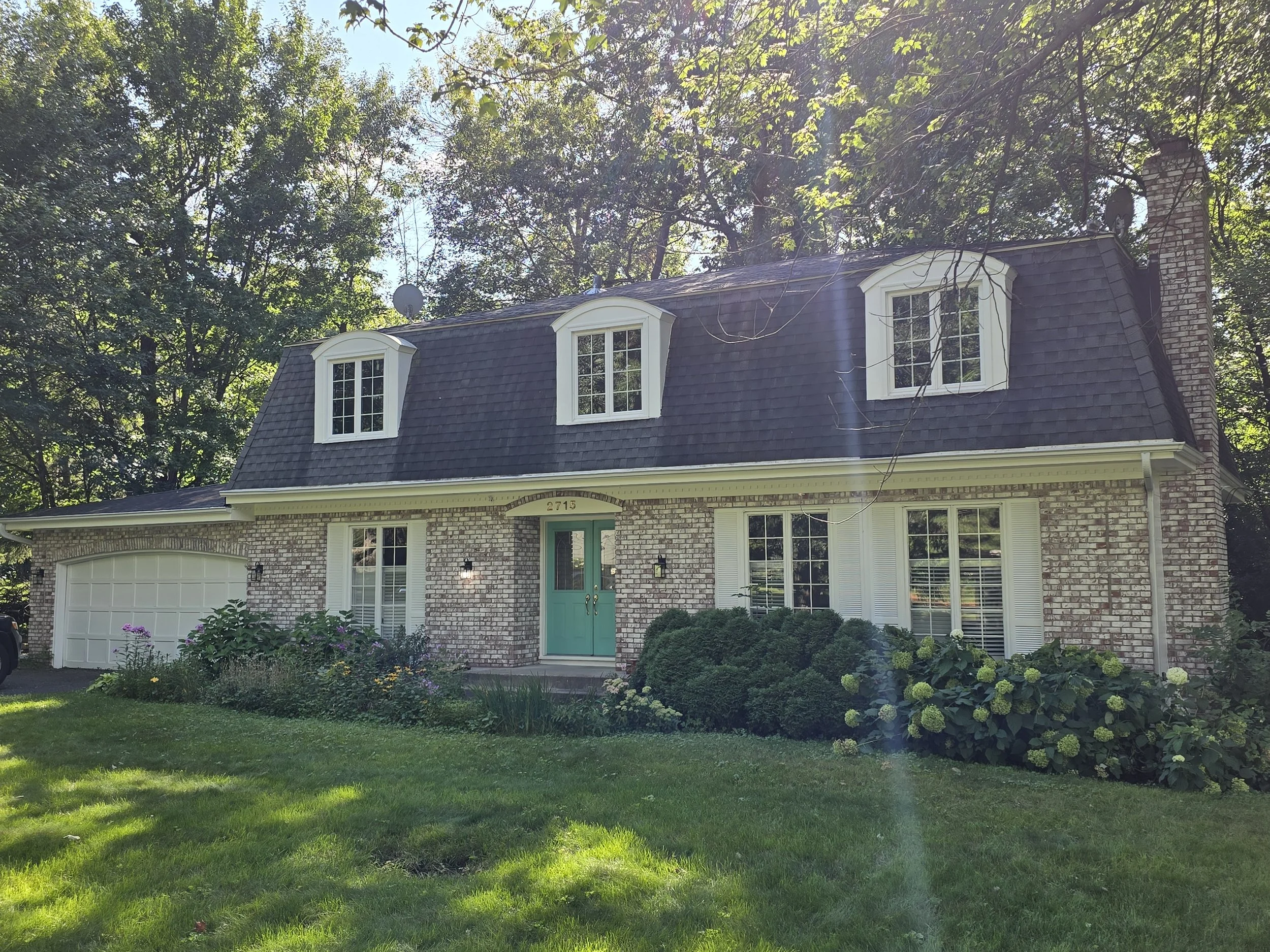 Classic exterior repaint in the Minneapolis lakes area, highlighted by charming dormers and fresh accent details
