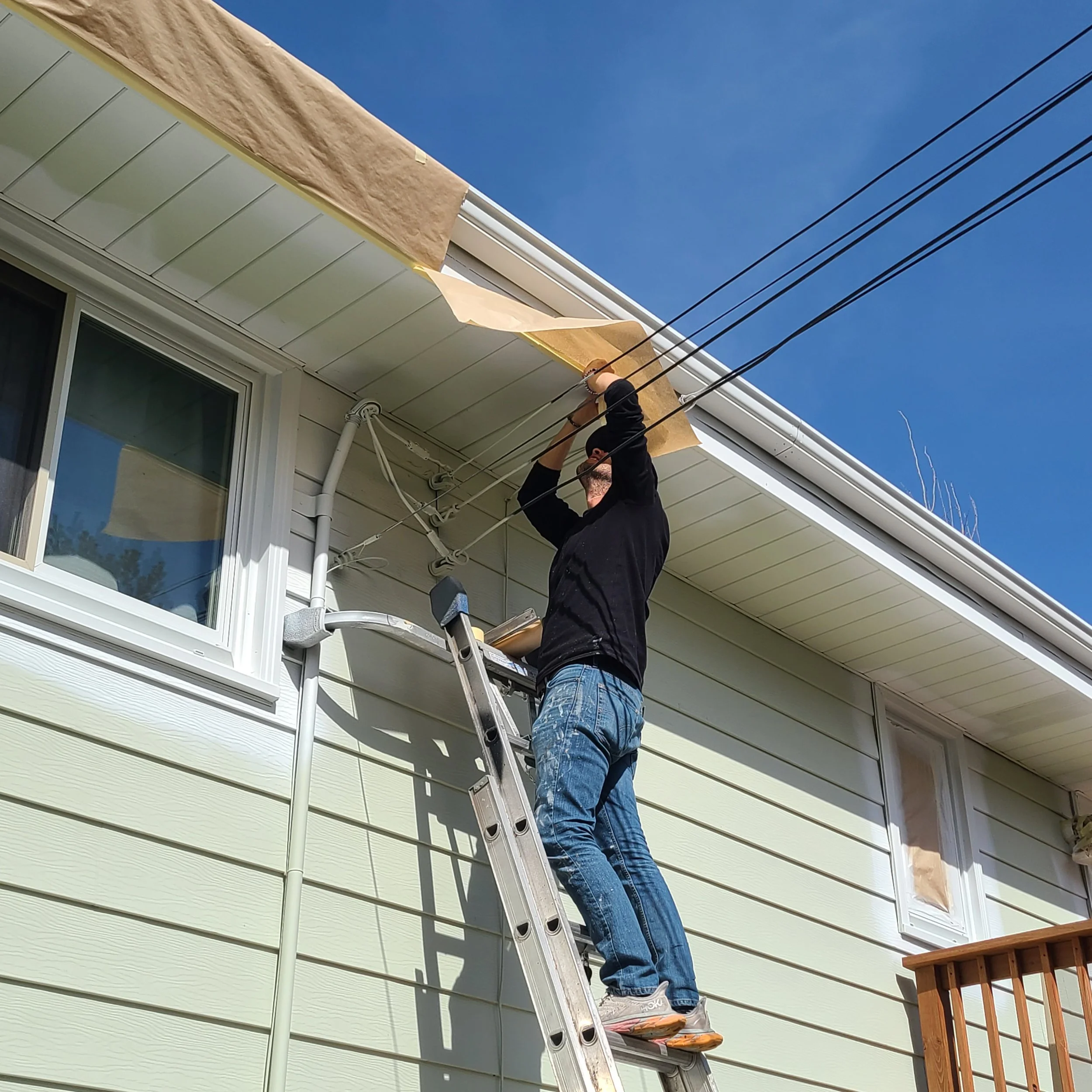 Careful exterior prep work including masking and protection before painting in Eagan