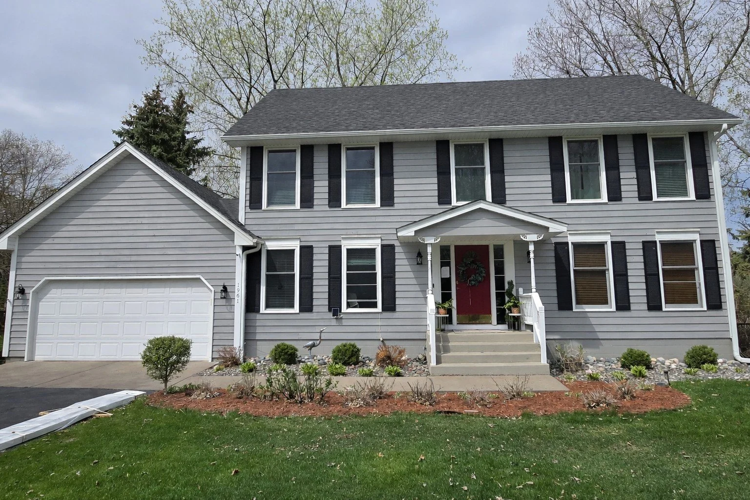 Classic gray colonial exterior repaint on a traditional Eagan home
