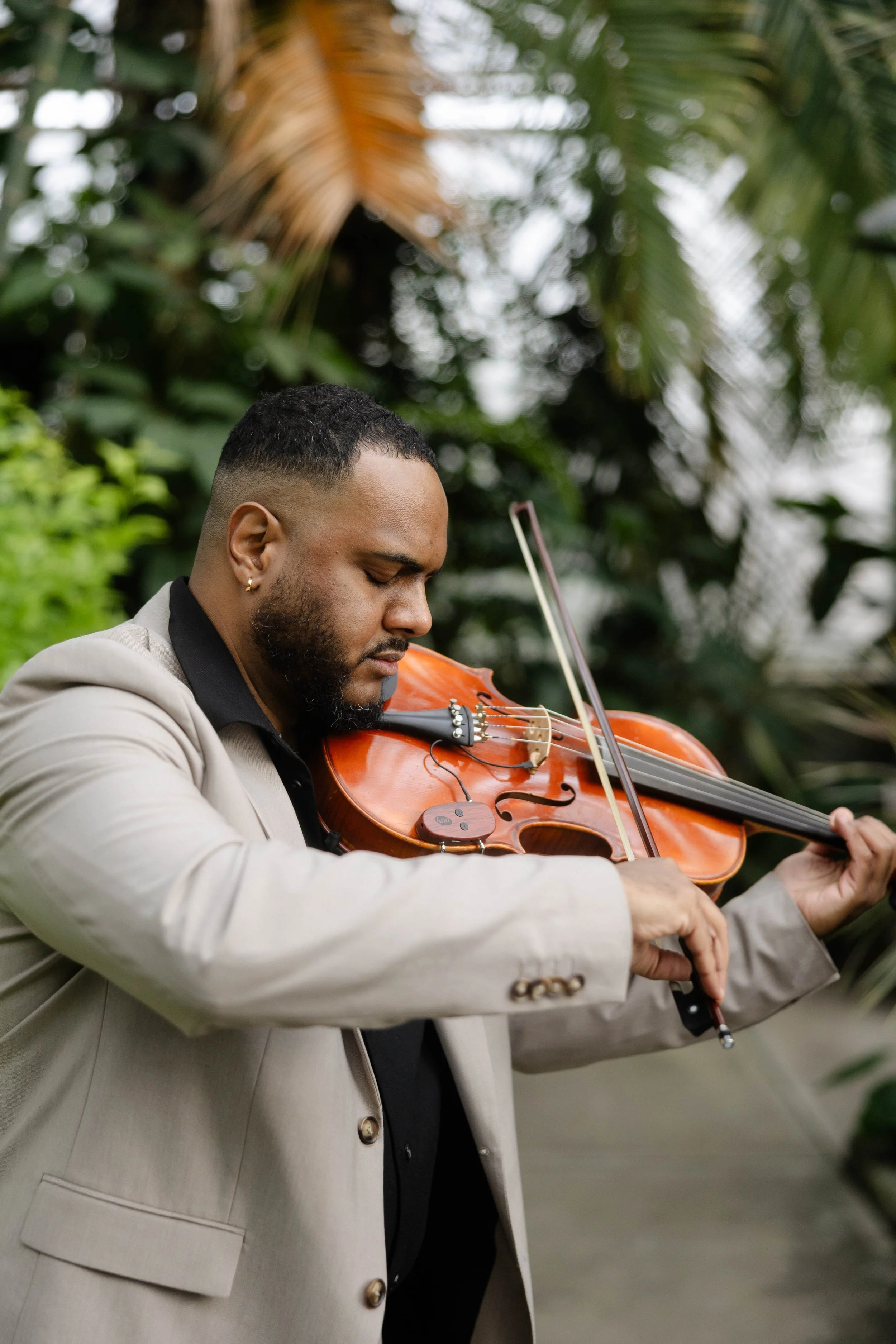 Photo of violist musician, passionately playing his instrument.