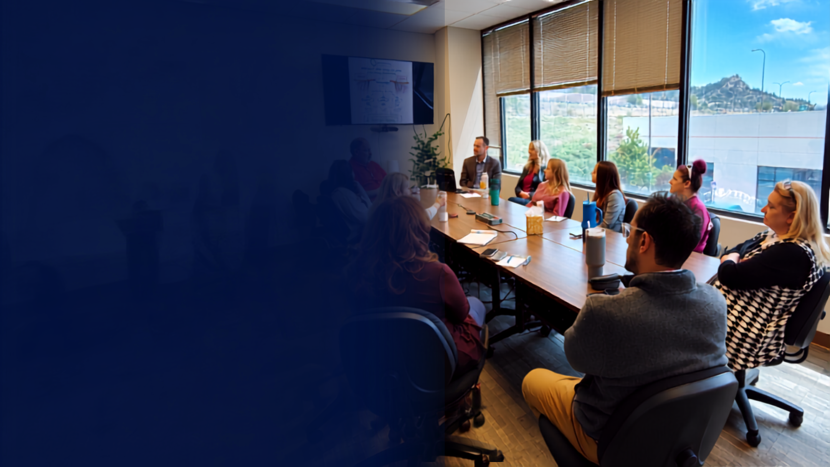 Group of people meeting around a conference table