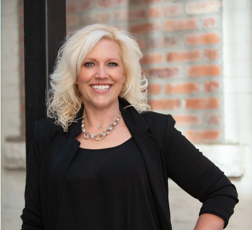 Photo of Karrie Pittman wearing black blouse and blazer.