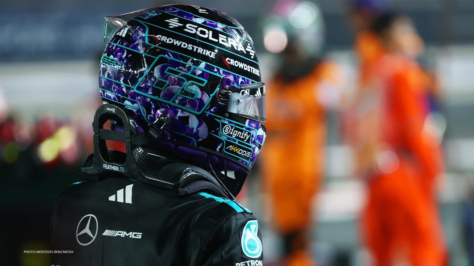 George Russell wearing his purple-patterned helmet and Mercedes race suit during the 2026 Singapore Grand Prix weekend.