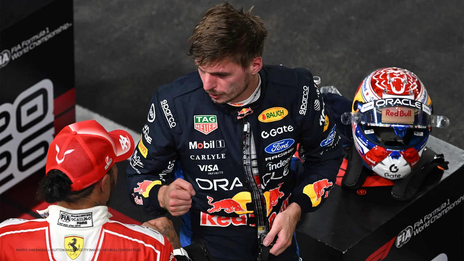 Max Verstappen and Lewis Hamilton congratulate each other in parc fermé after qualifying for the 2026 Singapore Grand Prix.