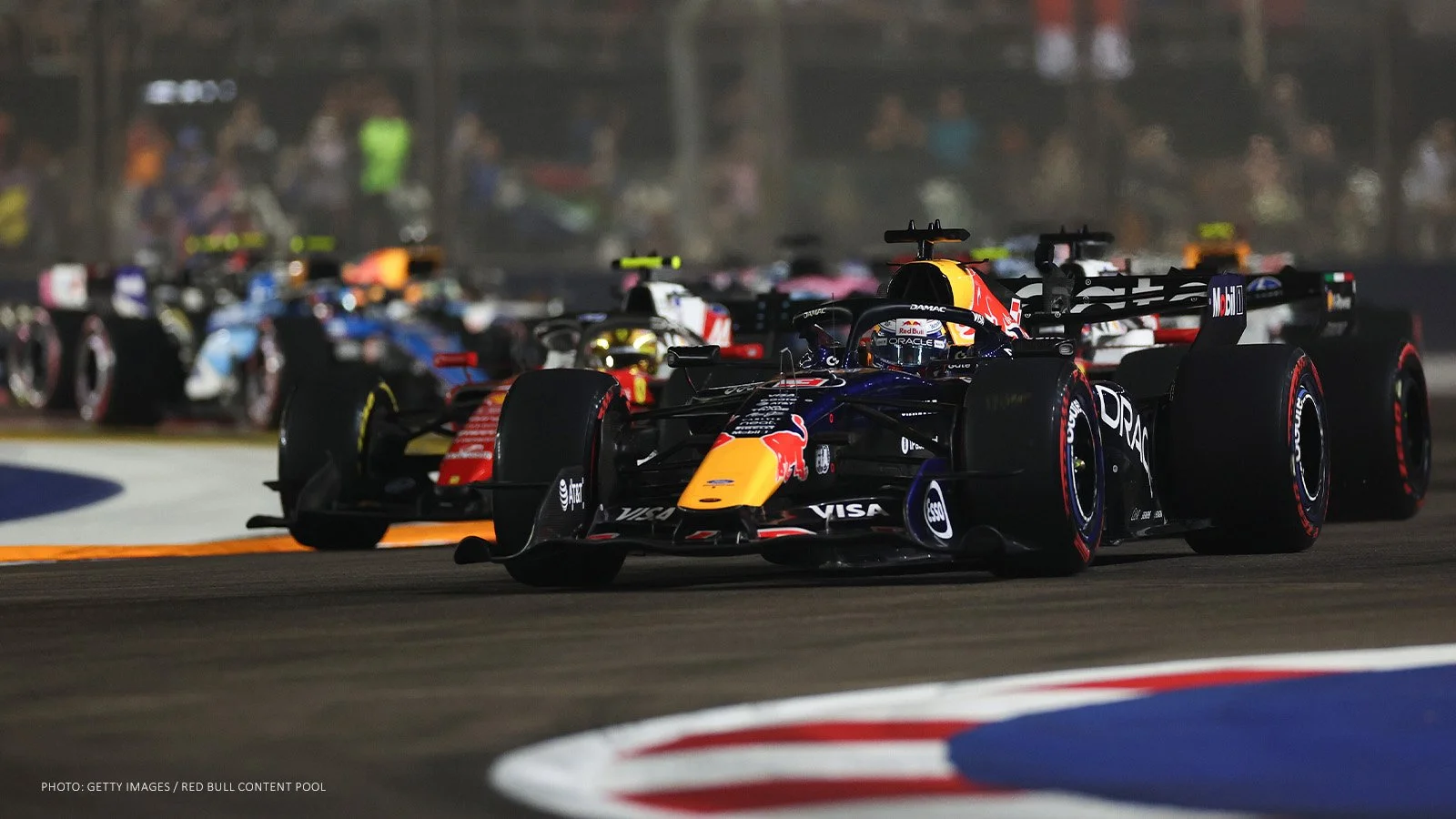 Max Verstappen leads the field through a corner during the 2026 Singapore Grand Prix.