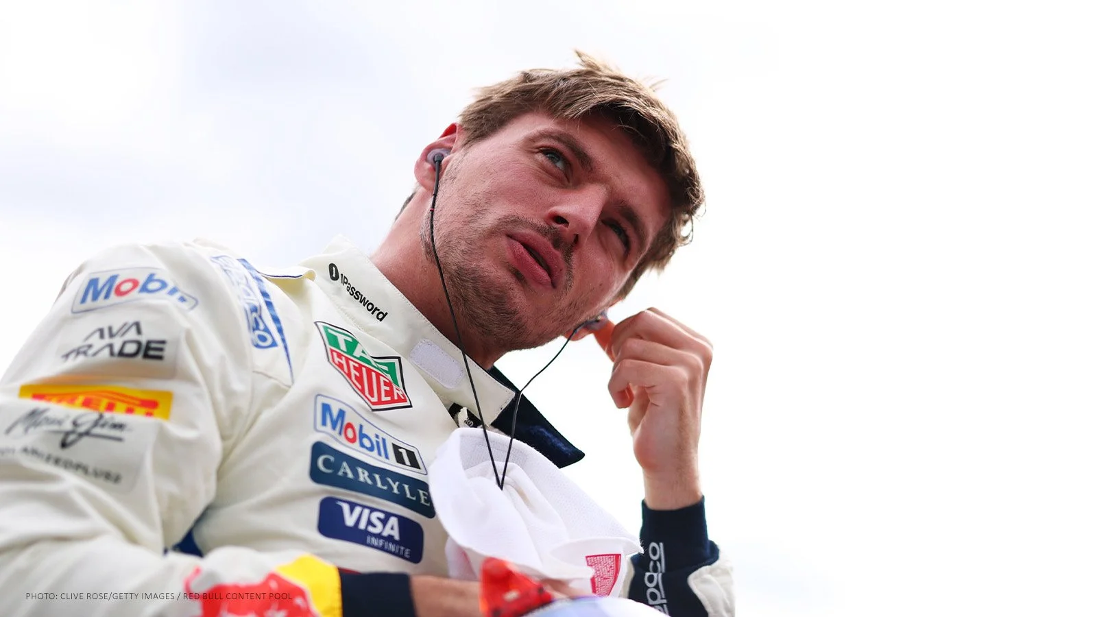 Max Verstappen adjusting his earpiece on the Austin grid before the 2026 United States Grand Prix.