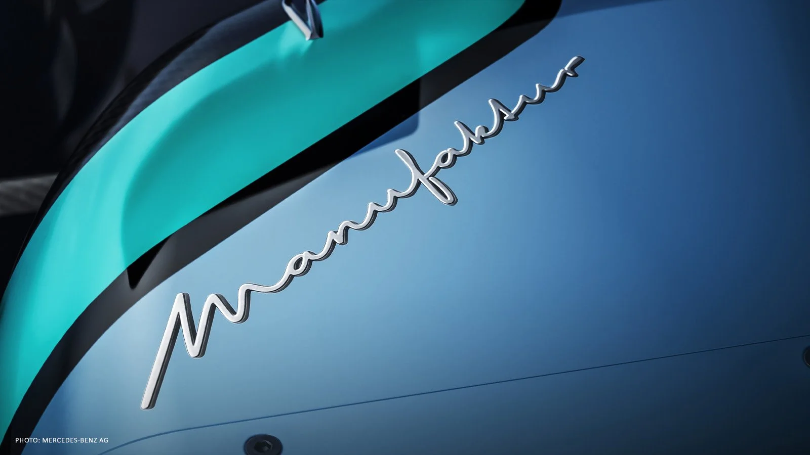 Close-up of the MANUFAKTUR script and blue bodywork on the Mercedes W17.