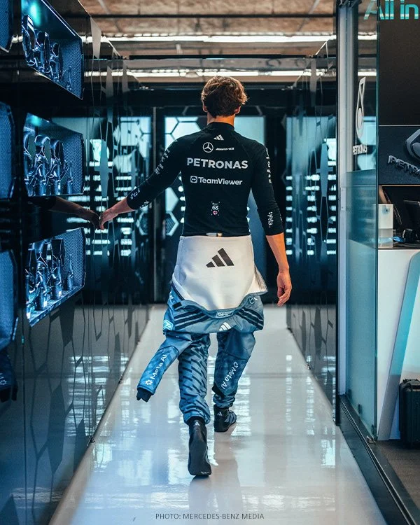George Russell walks through the Mercedes garage during the 2026 United States Grand Prix weekend.